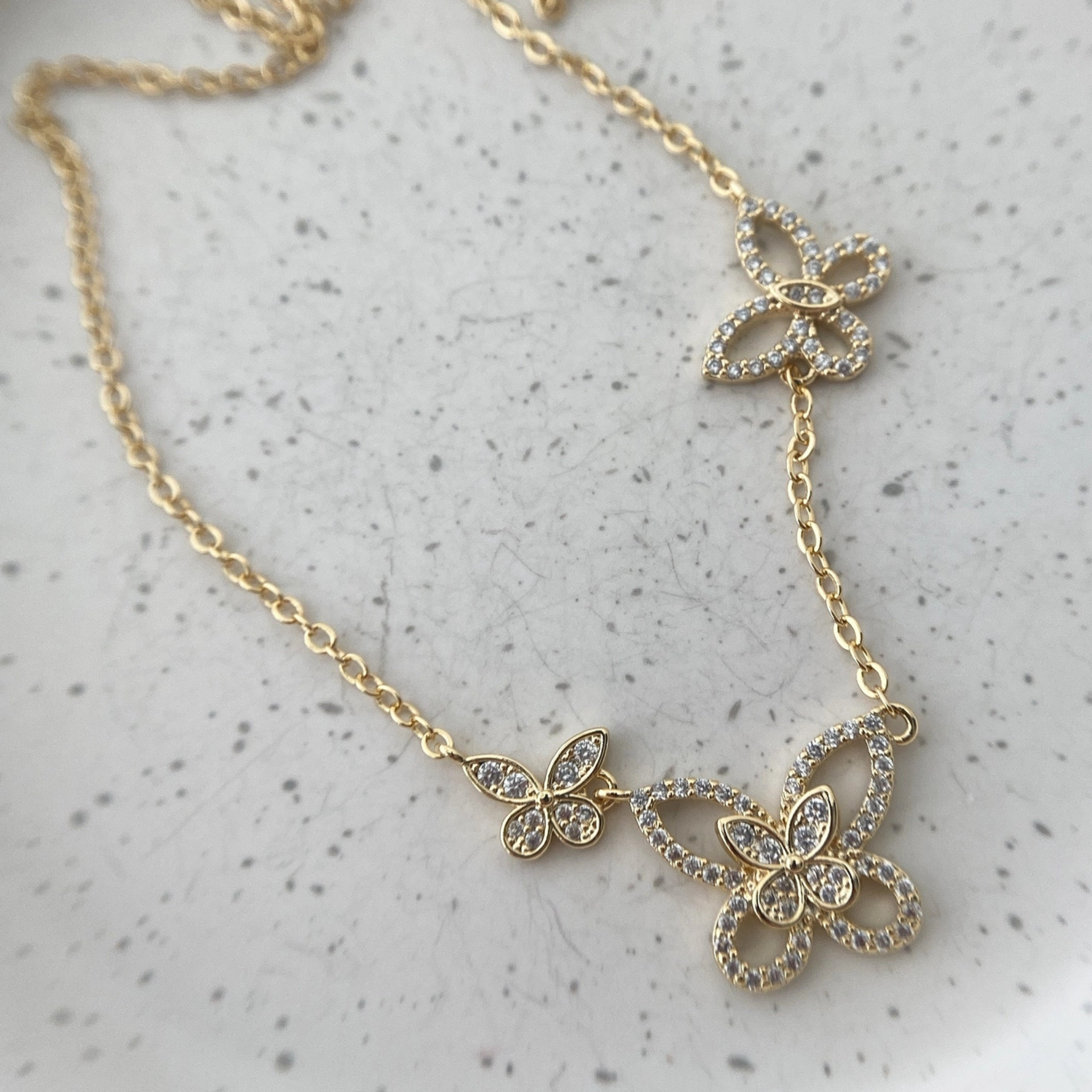 Private label butterfly dance necklace featuring a detailed butterfly pendant on a delicate chain.