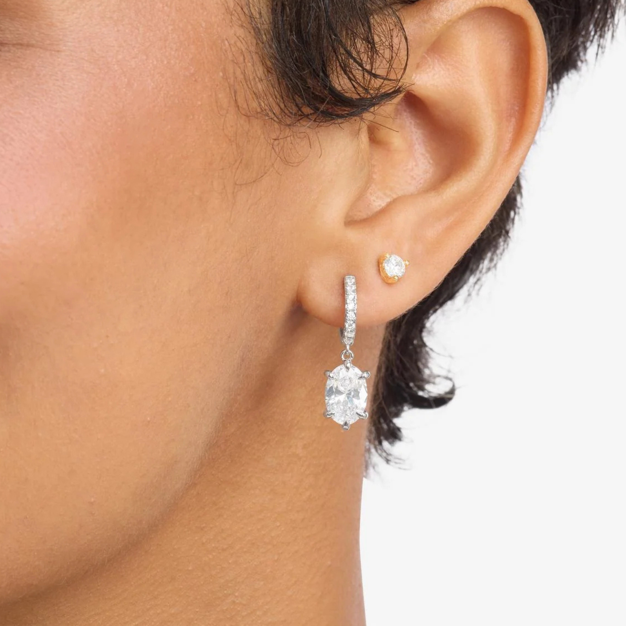 Silver She's On Point earrings by Melinda Maria featuring white diamondette accents and a stylish, modern design.