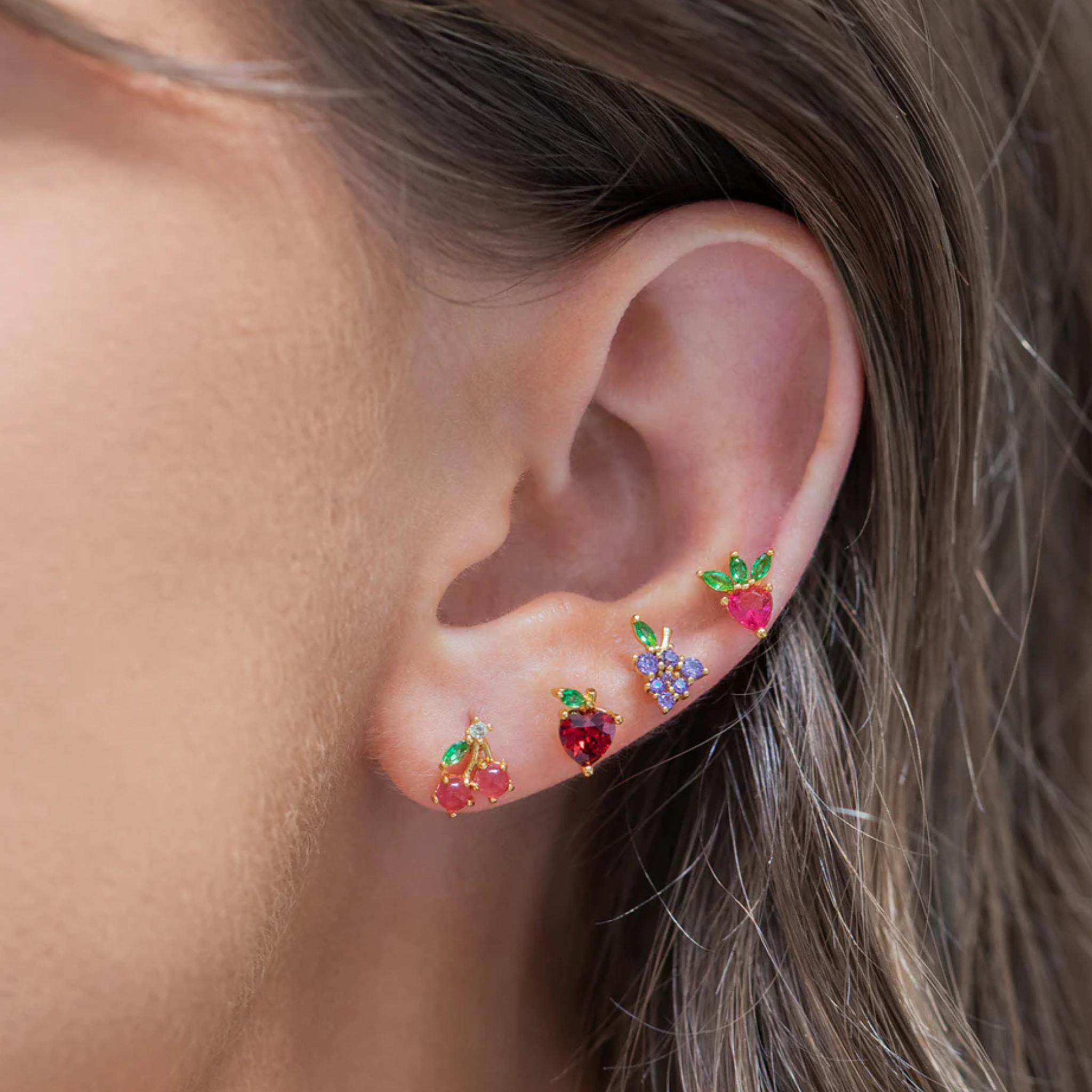 Colorful fruit basket stud earrings by Girls Crew featuring vibrant designs and playful details.