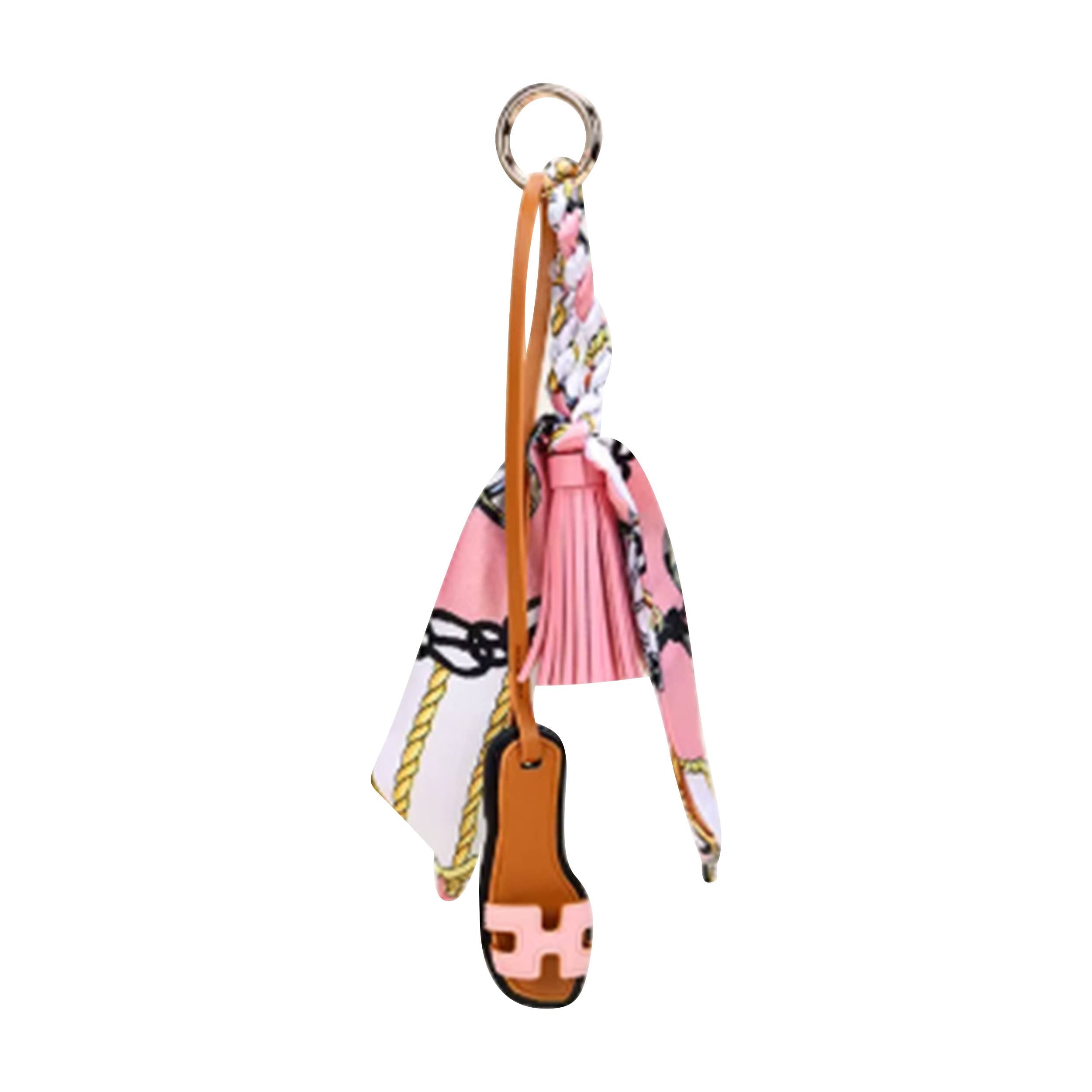 Malibu Sugar sandal with scarf bag charm, featuring decorative accessory hanging from the strap in a close-up image.