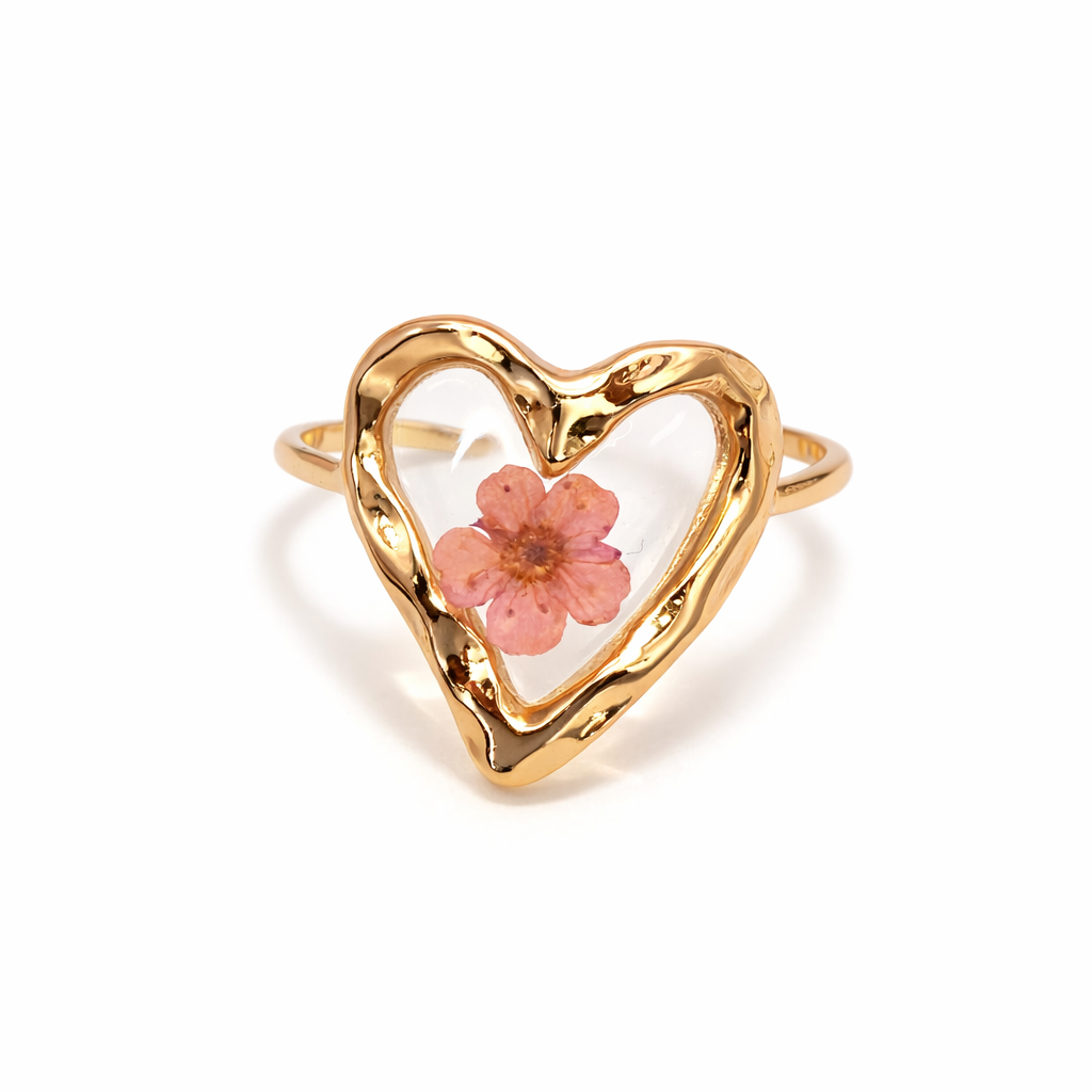 Pressed floral ring from Private Label featuring intricate floral design on a silver band, perfect for elegant jewelry.