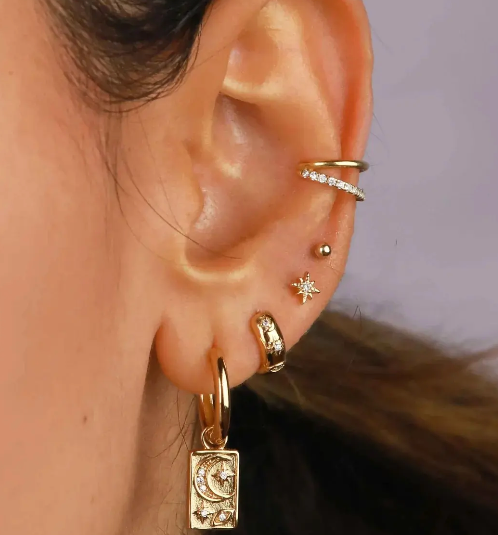 Chubby hoop earrings with evil eye design, featuring CZ stones and 18K gold waterproof PVD finish.