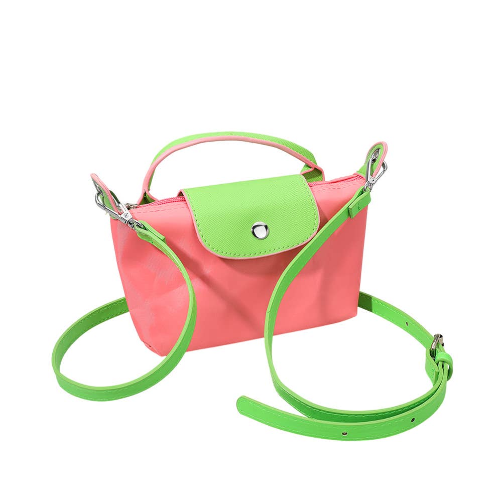 Private label compact two-tone handbag with crossbody strap, featuring stylish design and dual-tone leather accents.