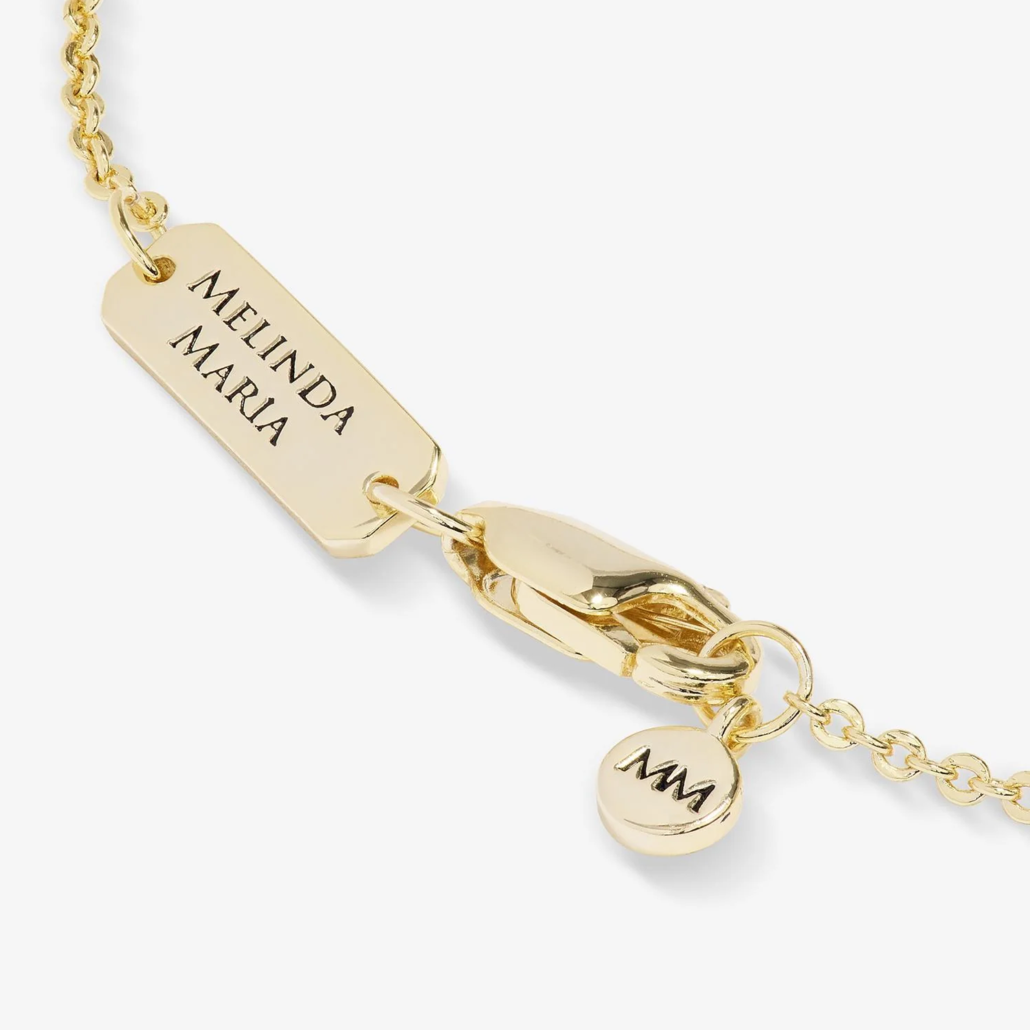 Blue Evil Eye Necklace by Melinda Maria featuring gold chain and white diamondette accents, showcasing the detailed pendant design.