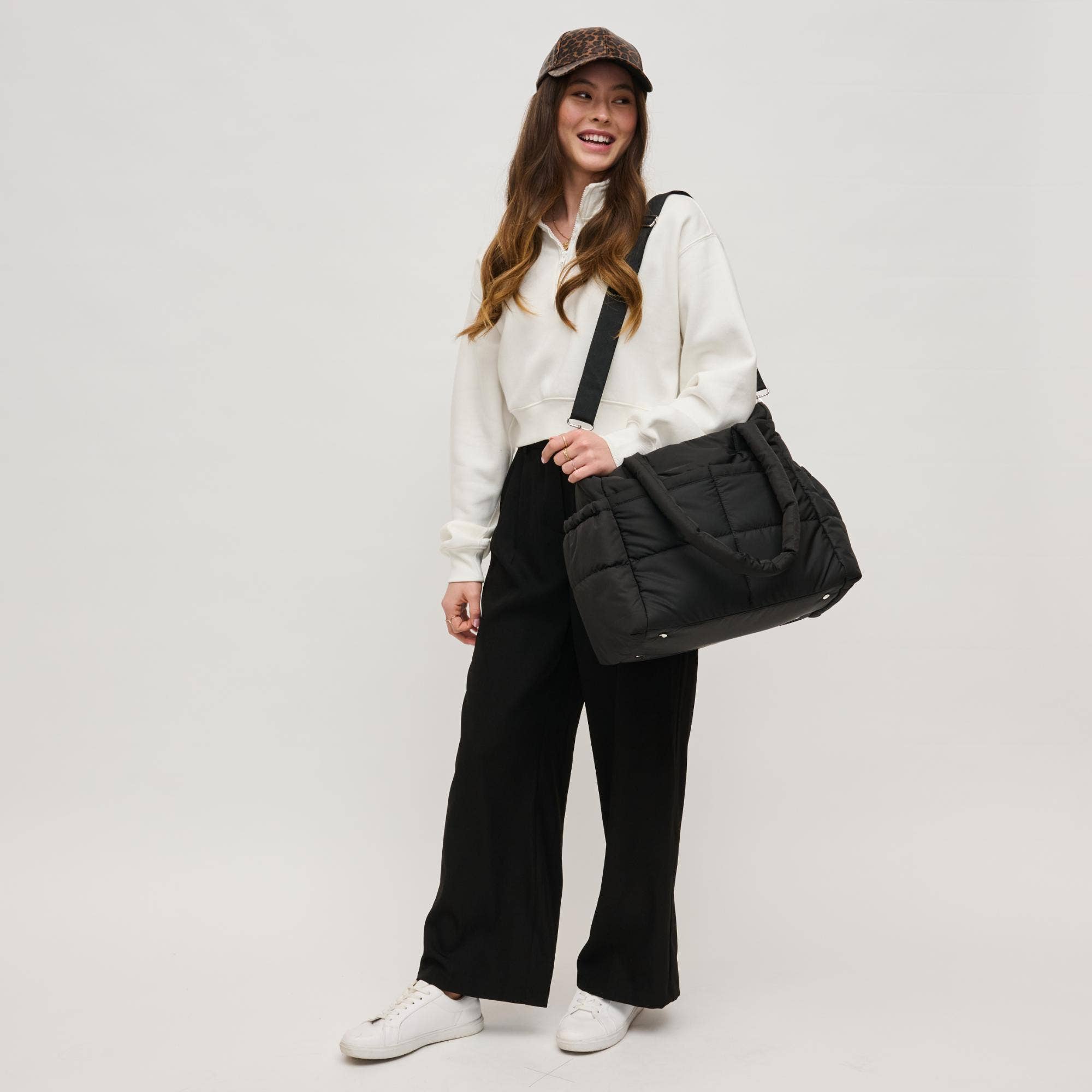 Urban Expressions Jetsetter Multi Compartment Travel Tote with multiple pockets and a stylish design for travel convenience.