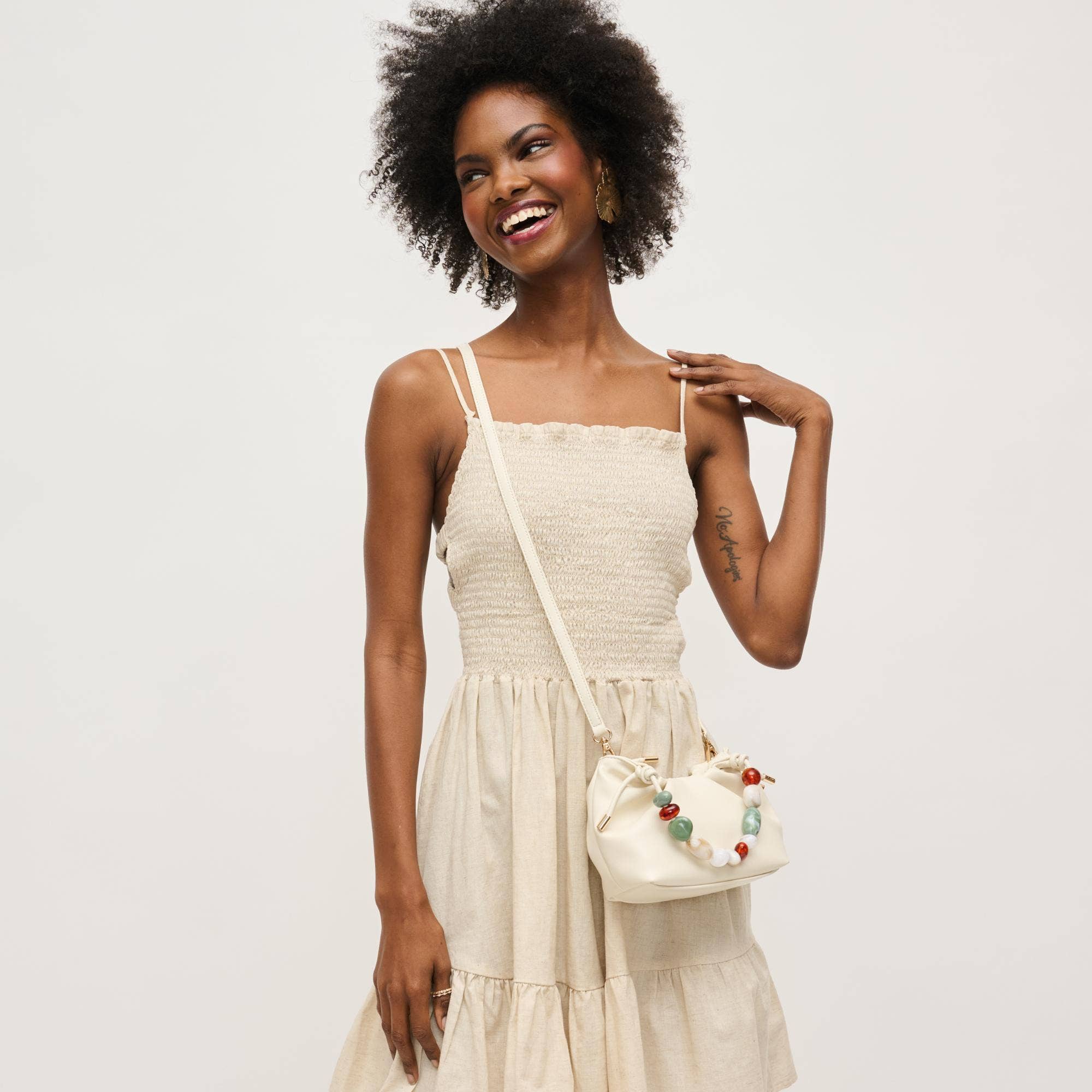 Urban Expressions Yzabelle Crossbody bag with adjustable strap and zipper closure, showing stylish black leather accessory.