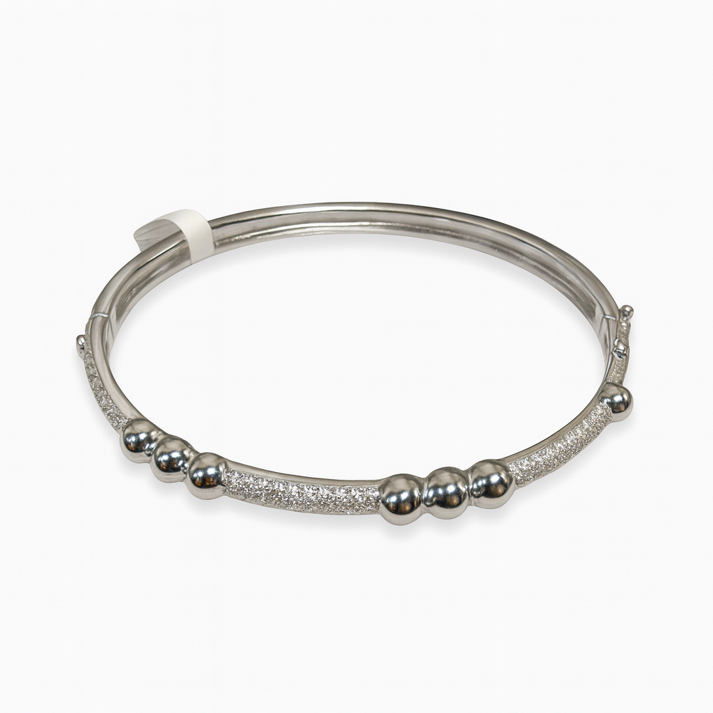 Three ball and pave bar bangle bracelet by The Skylar Project, featuring a sleek design and sparkling accents.
