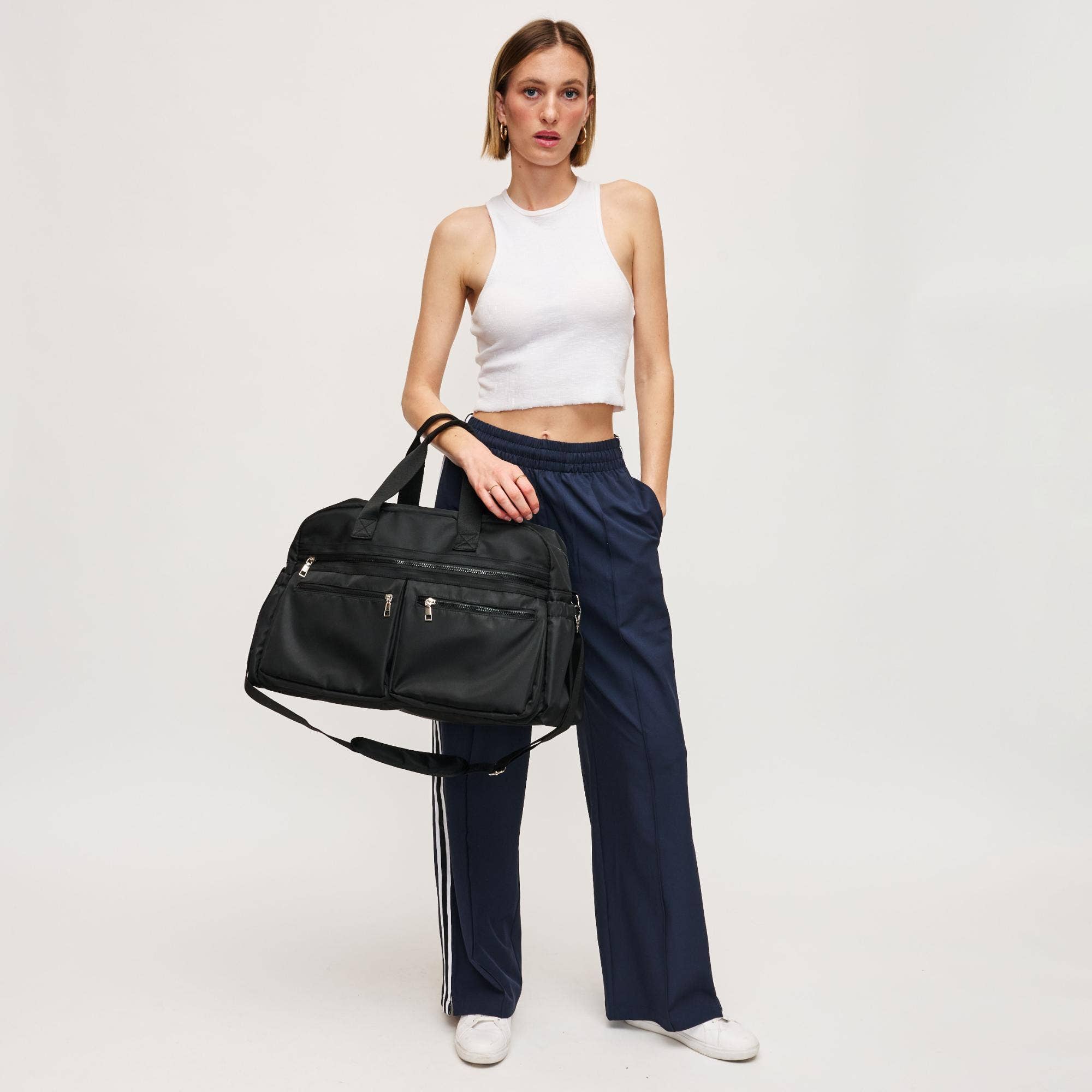 Urban Expressions Navigator Multi Compartment Weekender bag with multiple pockets and durable fabric in a stylish design.