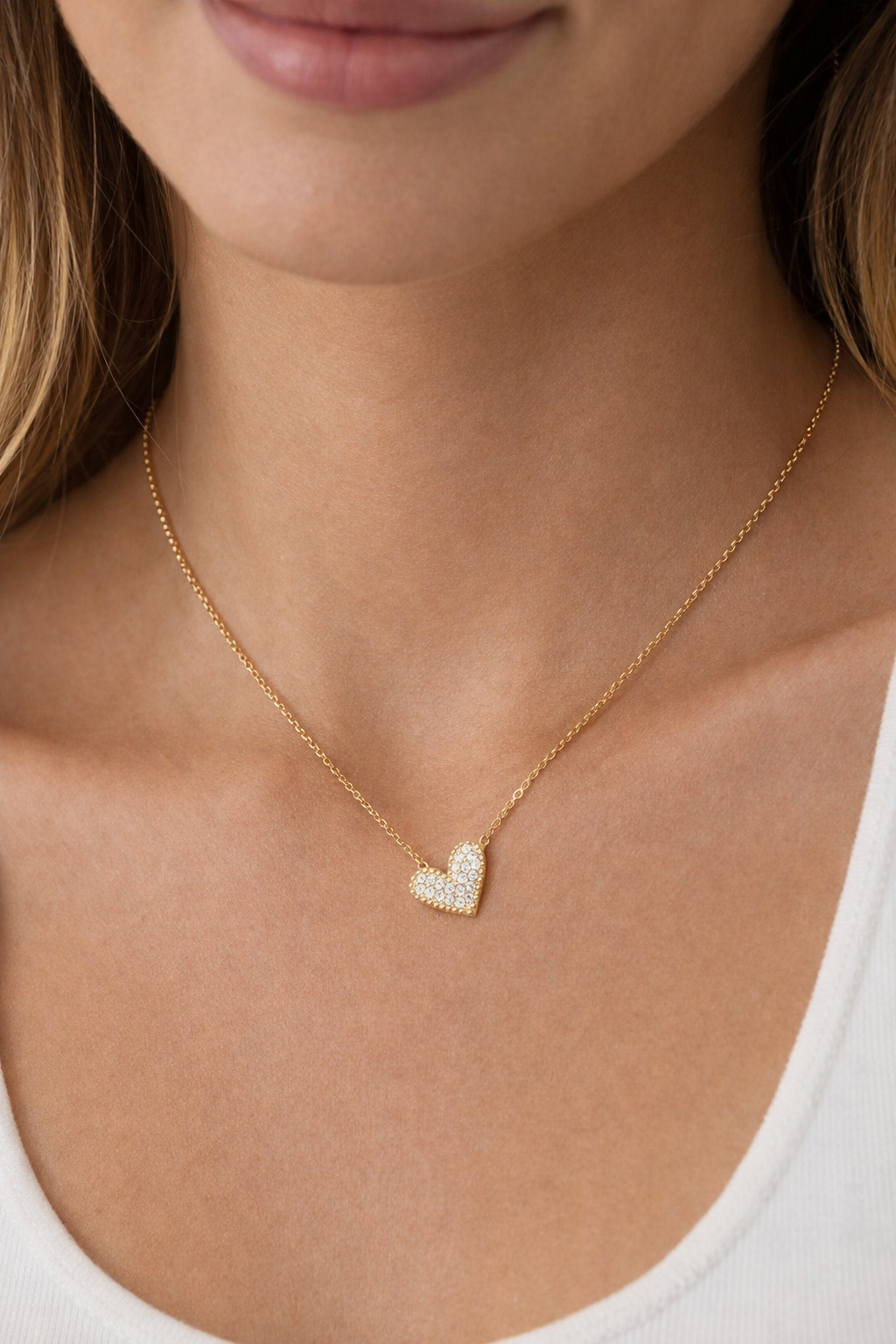 Private label sideways heart necklace featuring a delicate silver pendant on a fine chain.