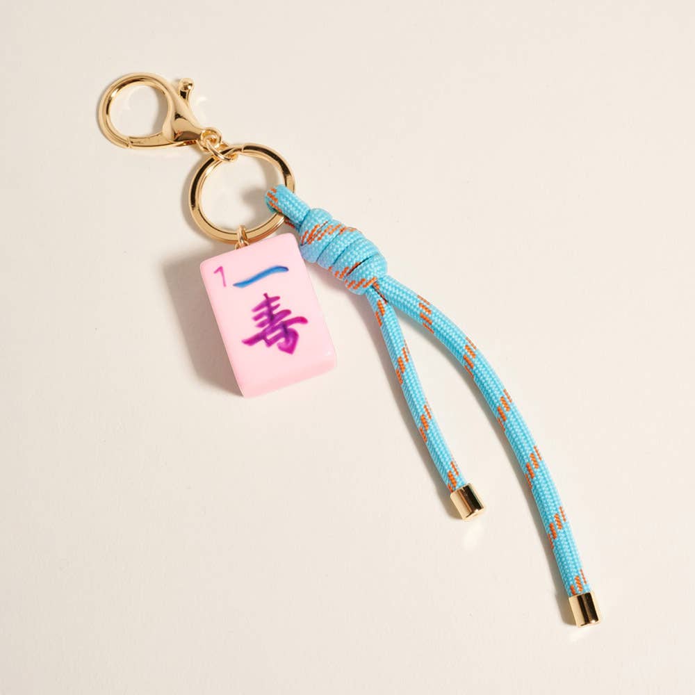 Private label Mahjong Tile Knot Strap Drop Keychain Bag Charm with decorative tile and woven knot design for accessories.