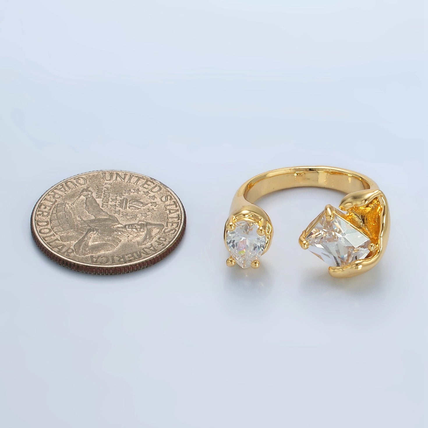 24K gold filled teardrop ring with CZ baguette stones, featuring a modern molten wrap design by Private Vendor.