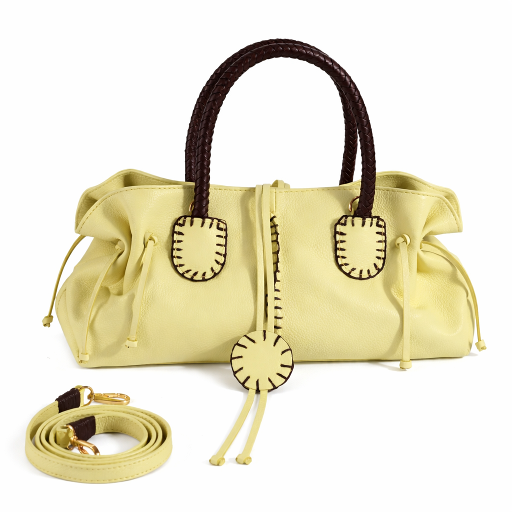 Carlos Falchi mini satchel bag with a sleek design, featuring a smooth surface and compact size for versatile style.