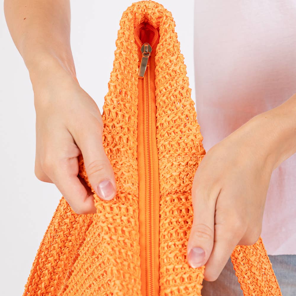 Solid crochet straw tote bag, private label beach handbag with woven design and sturdy handles for summer outings.