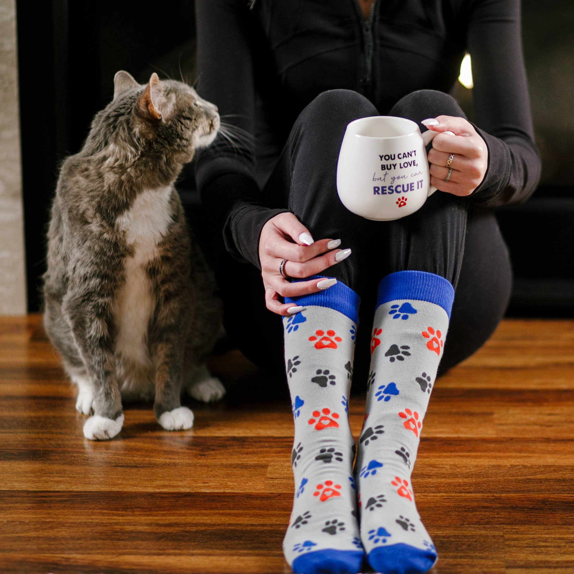 Pavilion Rescue mug and cozy socks set, showcasing a colorful mug paired with soft, stylish socks on a white background.
