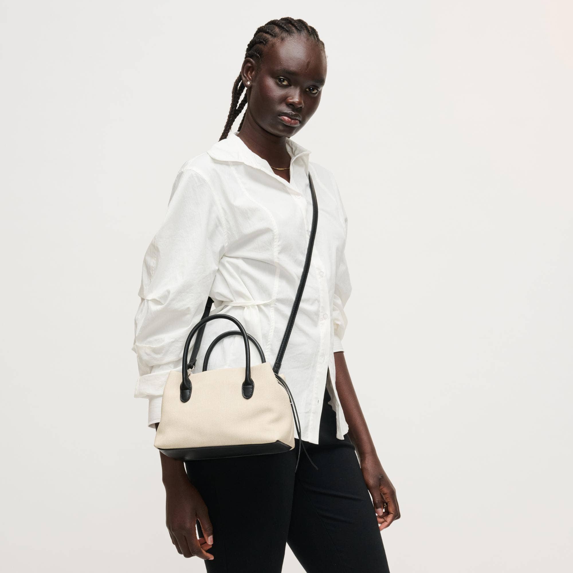 Urban Expressions Logan Crossbody bag with adjustable strap, stylish and practical accessory for everyday use.