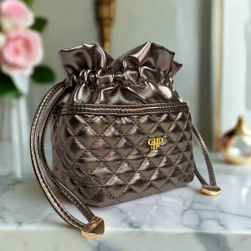 PurseN Oprah's Favorite Things 2021 Ultra Jewelry Case in bronze with compartments for necklaces, rings, and earrings.