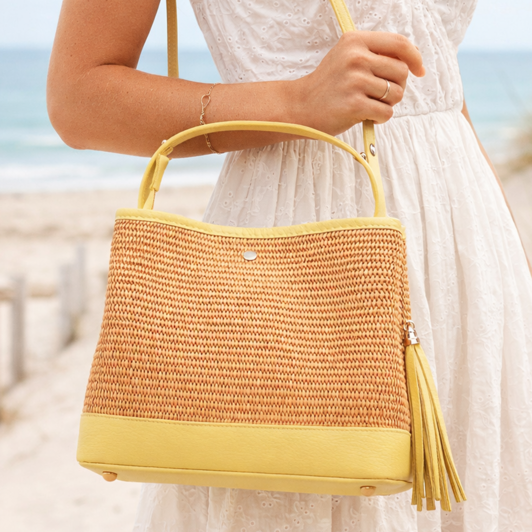 Private label raffia handbag with genuine leather details, showcasing woven texture and stylish design.