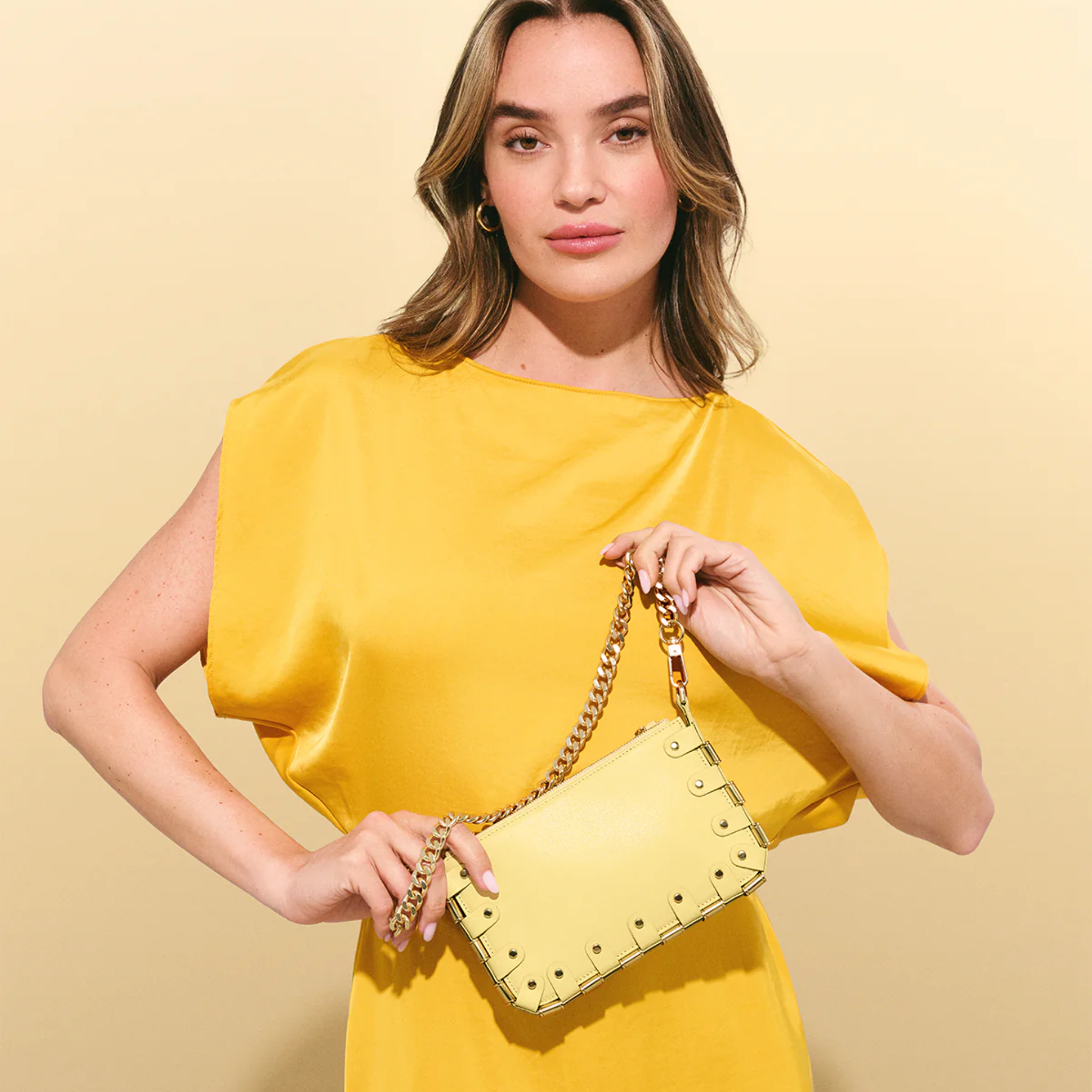 RAPT The Rapture Crossbody Bag in black with adjustable strap and sleek design, featuring the brand logo on the front.