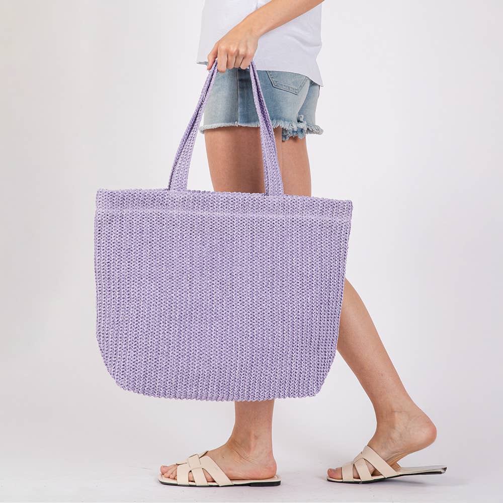 Solid crochet straw tote bag by Private label, stylish beach handbag with woven straw design and sturdy handles.
