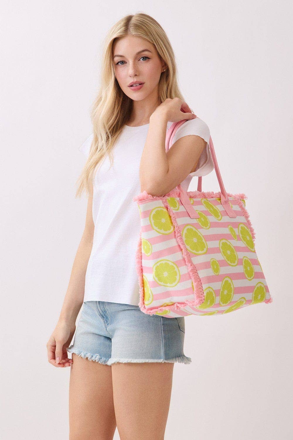 Lemon stripe fringe beach tote bag with woven handles, perfect for summer trips and beach outings.
