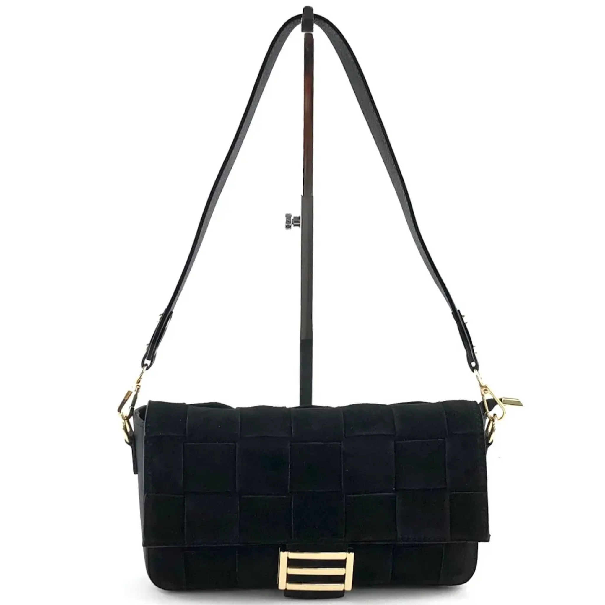 Black quilted handbag with gold accents on a white background