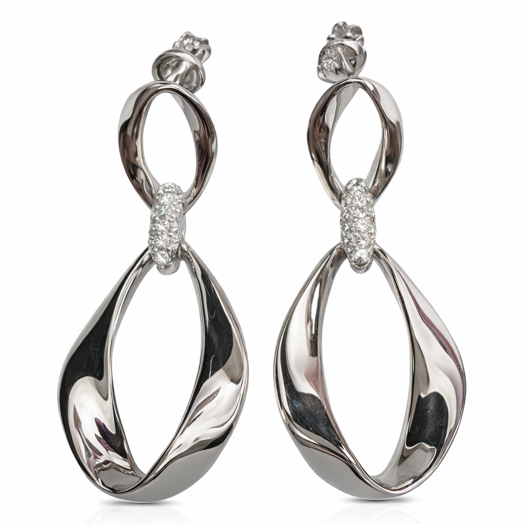 Silver infinity twist drop earrings by private label, featuring sleek, metallic design with elegant dangling style.