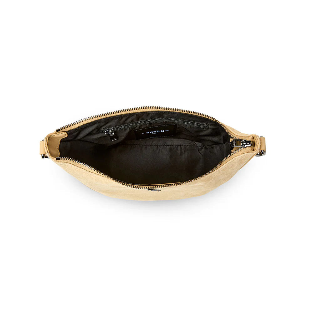 Think Royln Moonbeam bag with sleek design, featuring a compact shape and modern style, shown in a close-up view.