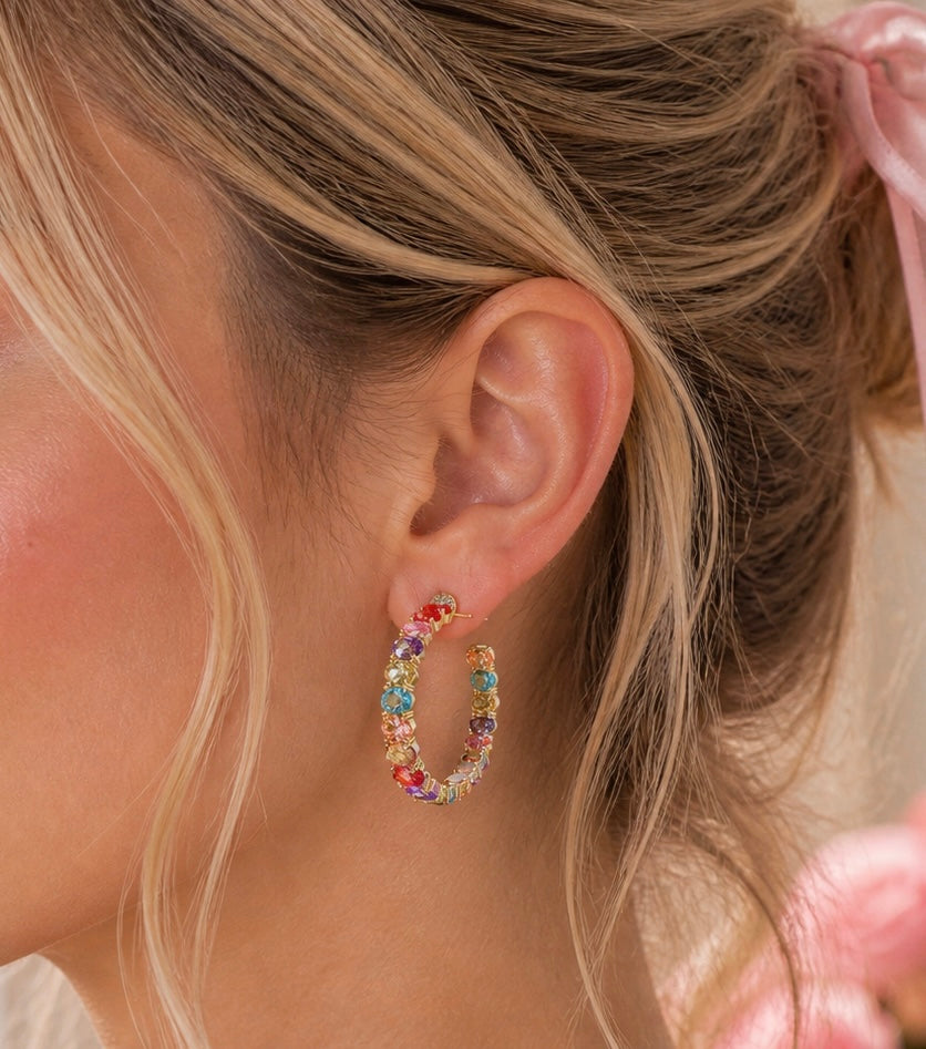 Private label Sadie jeweled hoop earrings featuring sparkling embellishments on gold-tone hoops.
