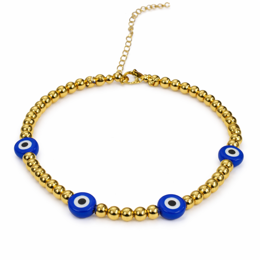 Gold beaded Evil Eye bracelet from The Skylar Project featuring blue evil eye beads on a white background.