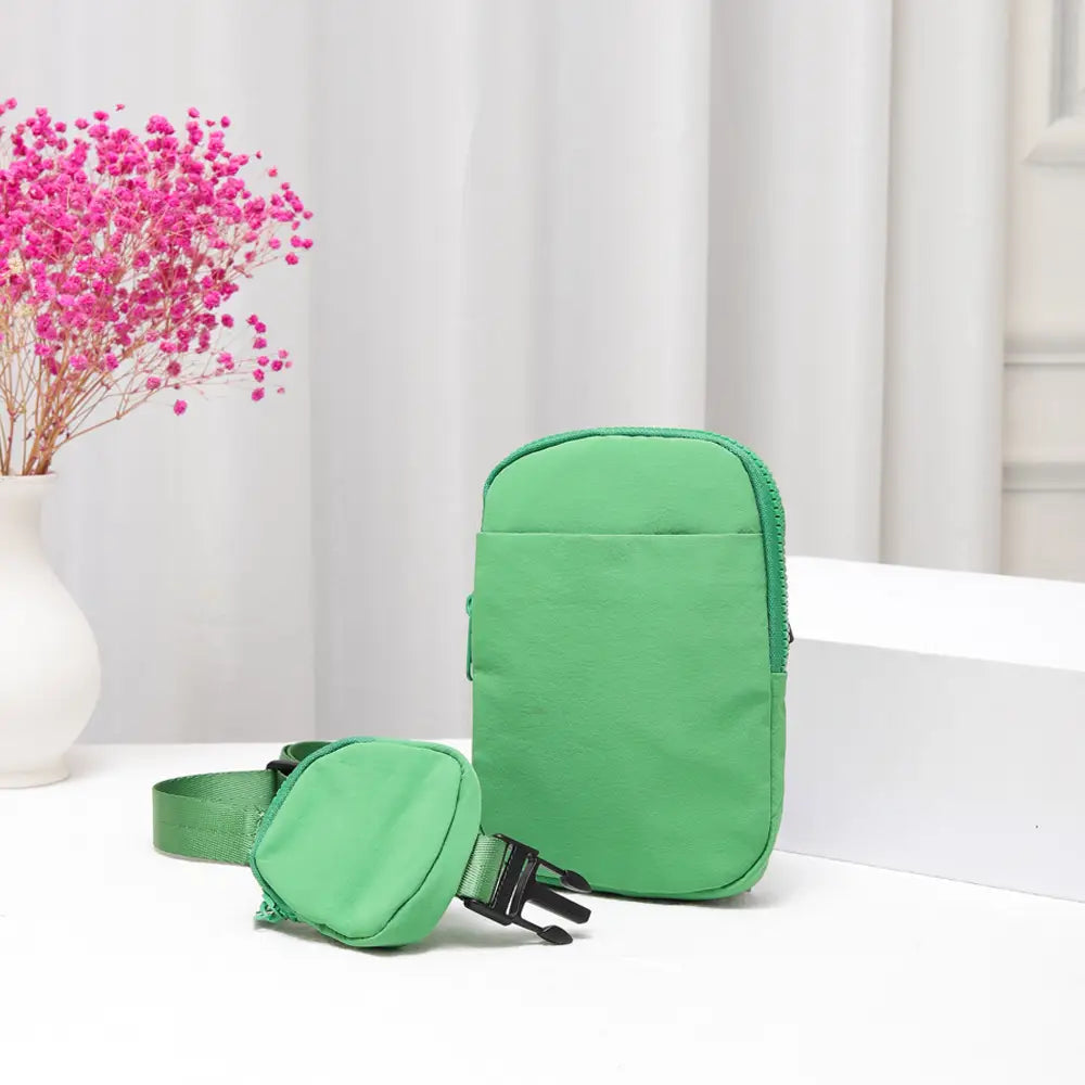 Green solid nylon sling bag with adjustable strap, crossbody style, made by private label.