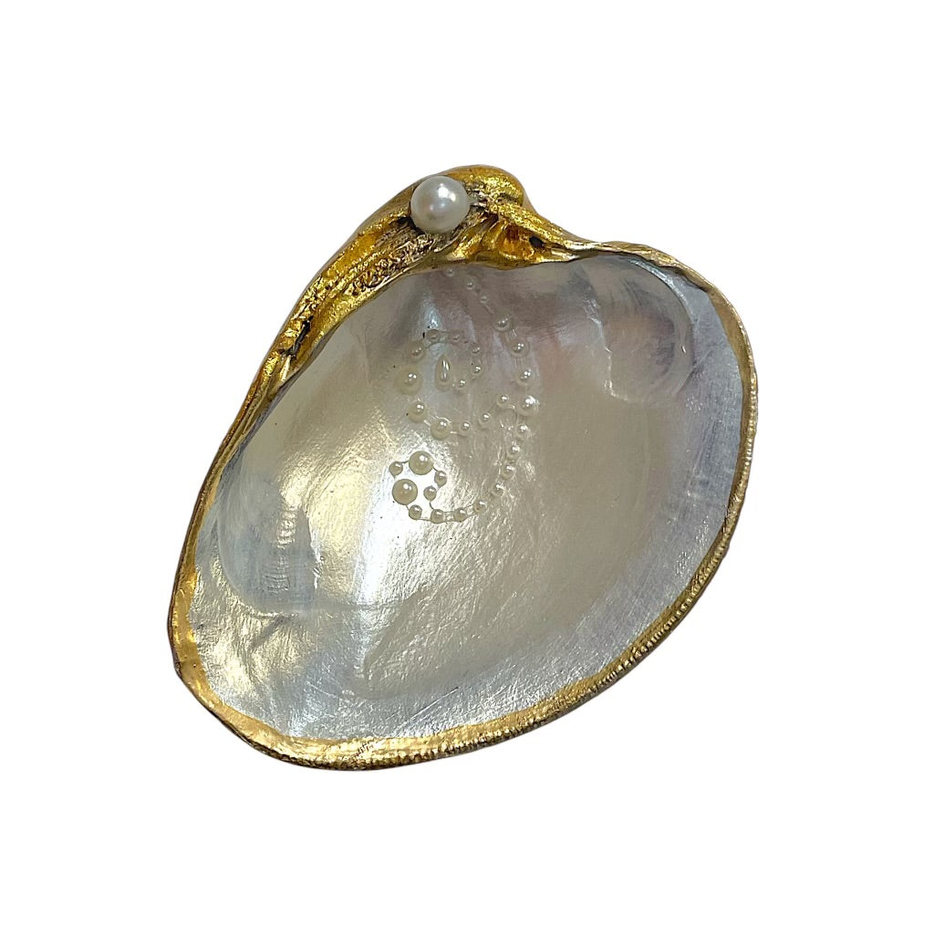 Decorative decoupage shells from private label, showcasing intricate designs and natural textures.