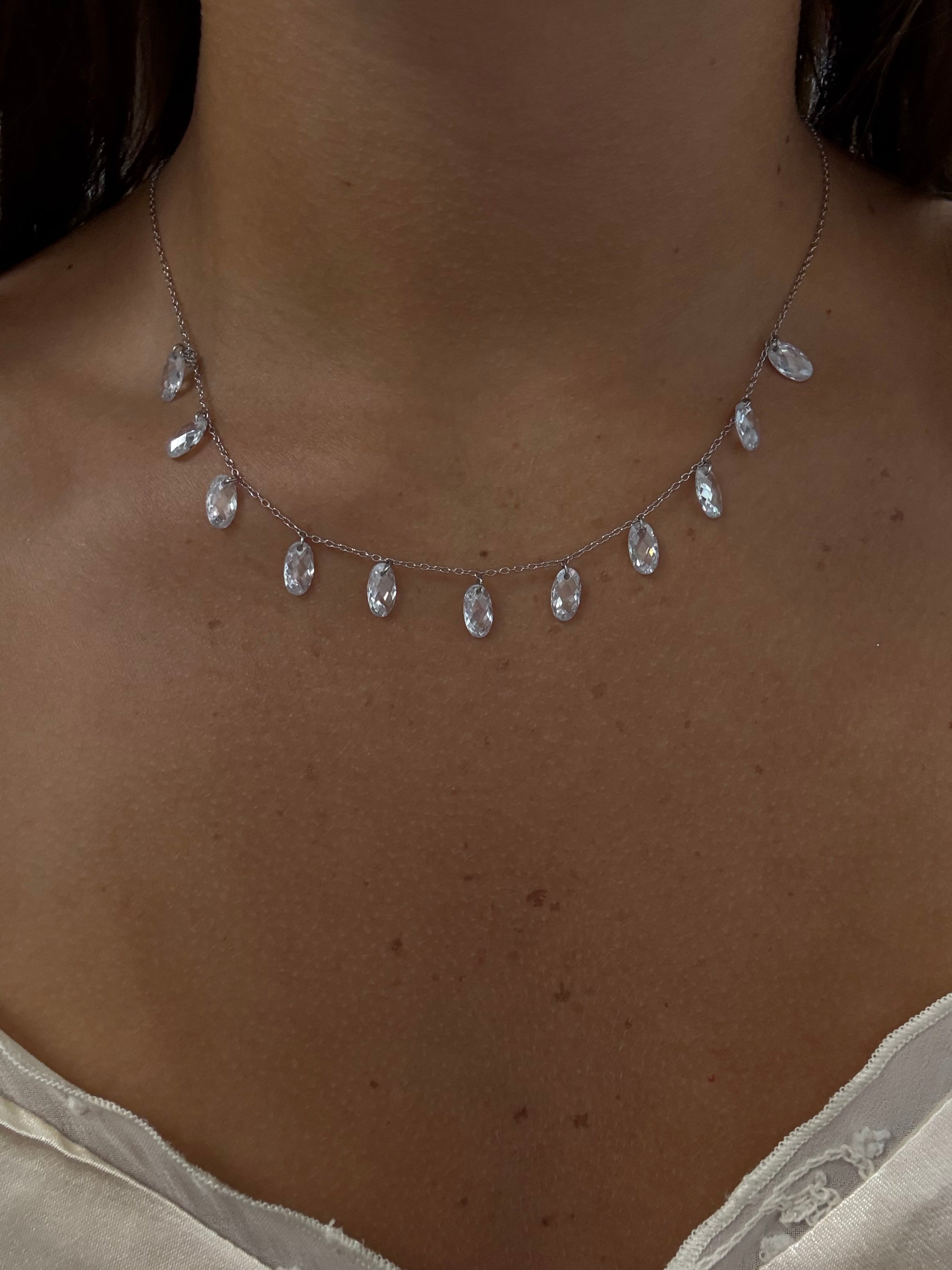 Iridescent clear crystal drop necklace in sterling silver 925, showcasing elegant design and sparkling details.