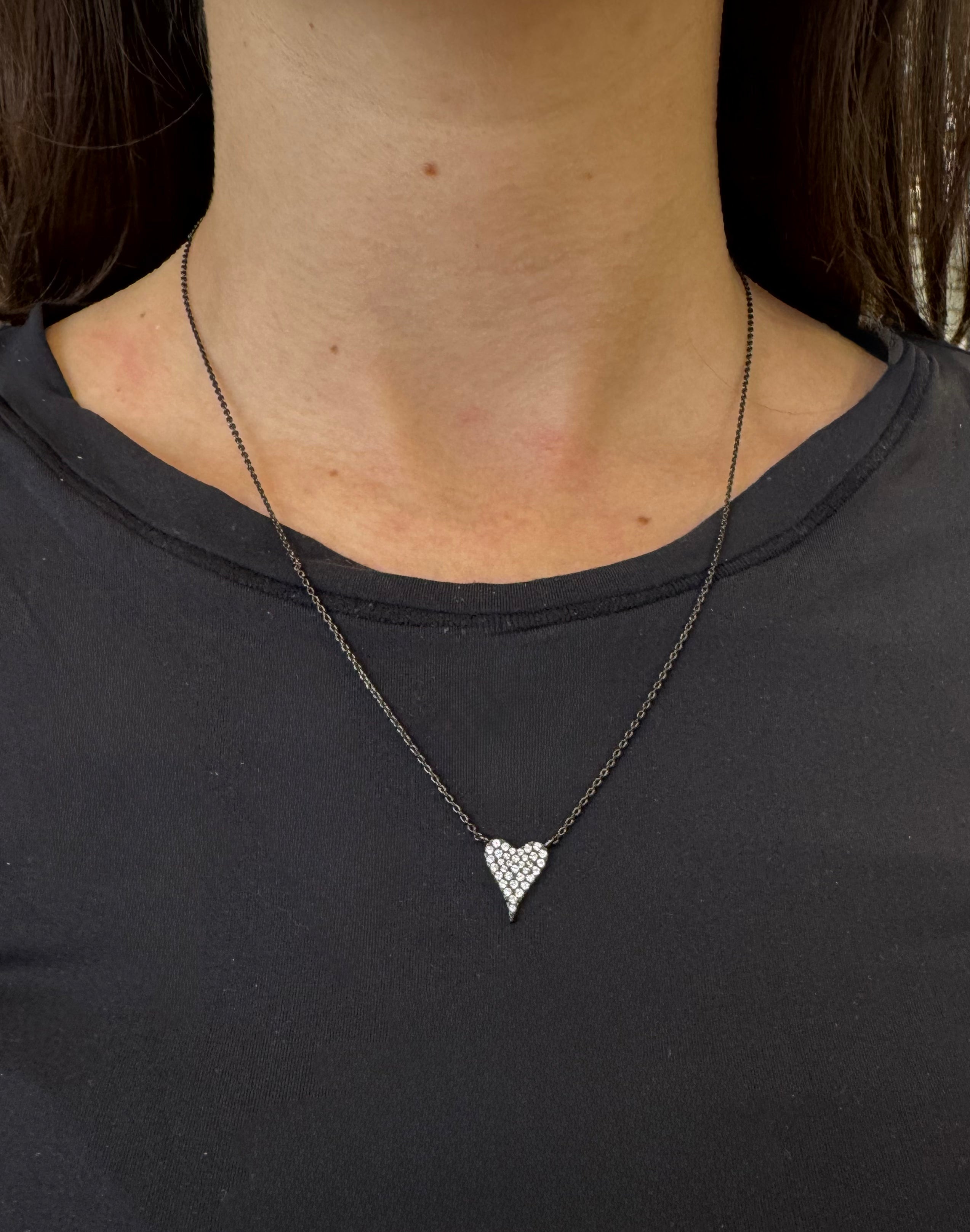 Mini Heart Me Necklace by SA featuring a delicate heart pendant and fine chain, elegantly displayed on a white background.