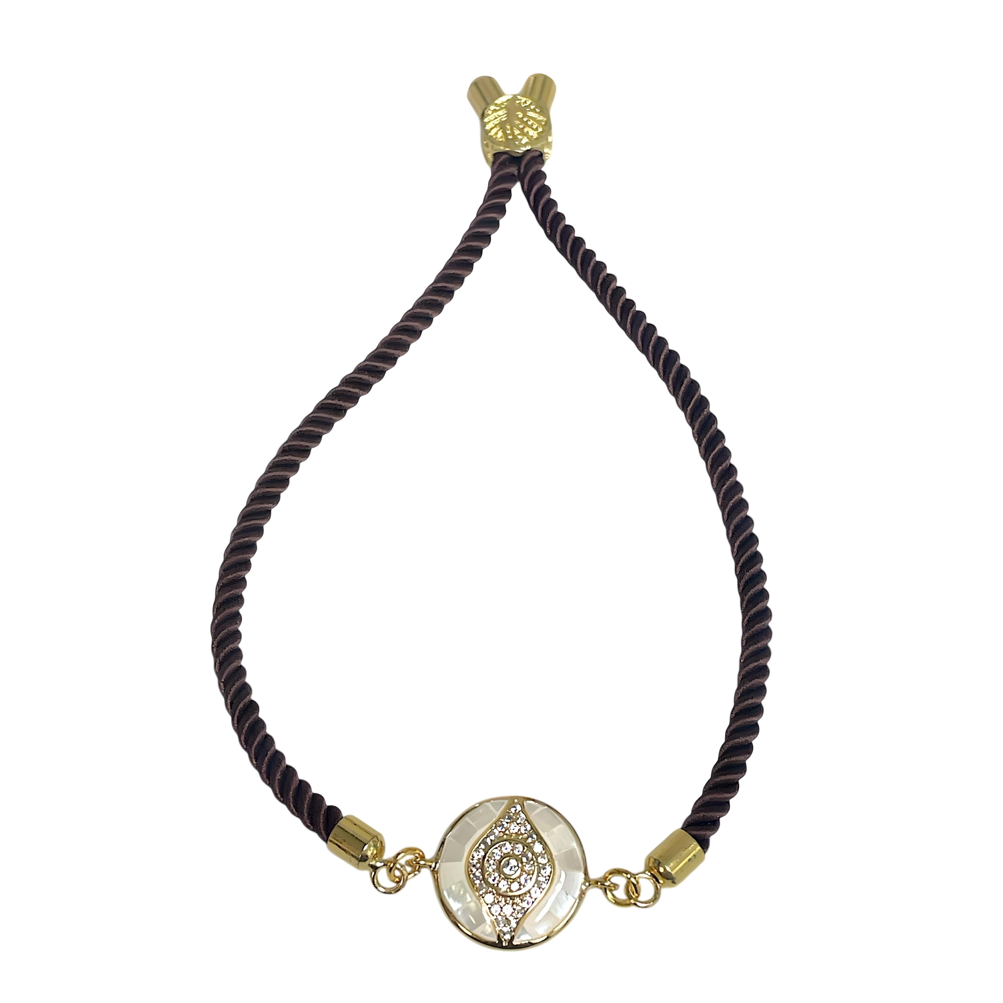 Brenda Perruzza Jewelry rope pulley bracelet featuring layered black and gold cords with adjustable sliding clasps.