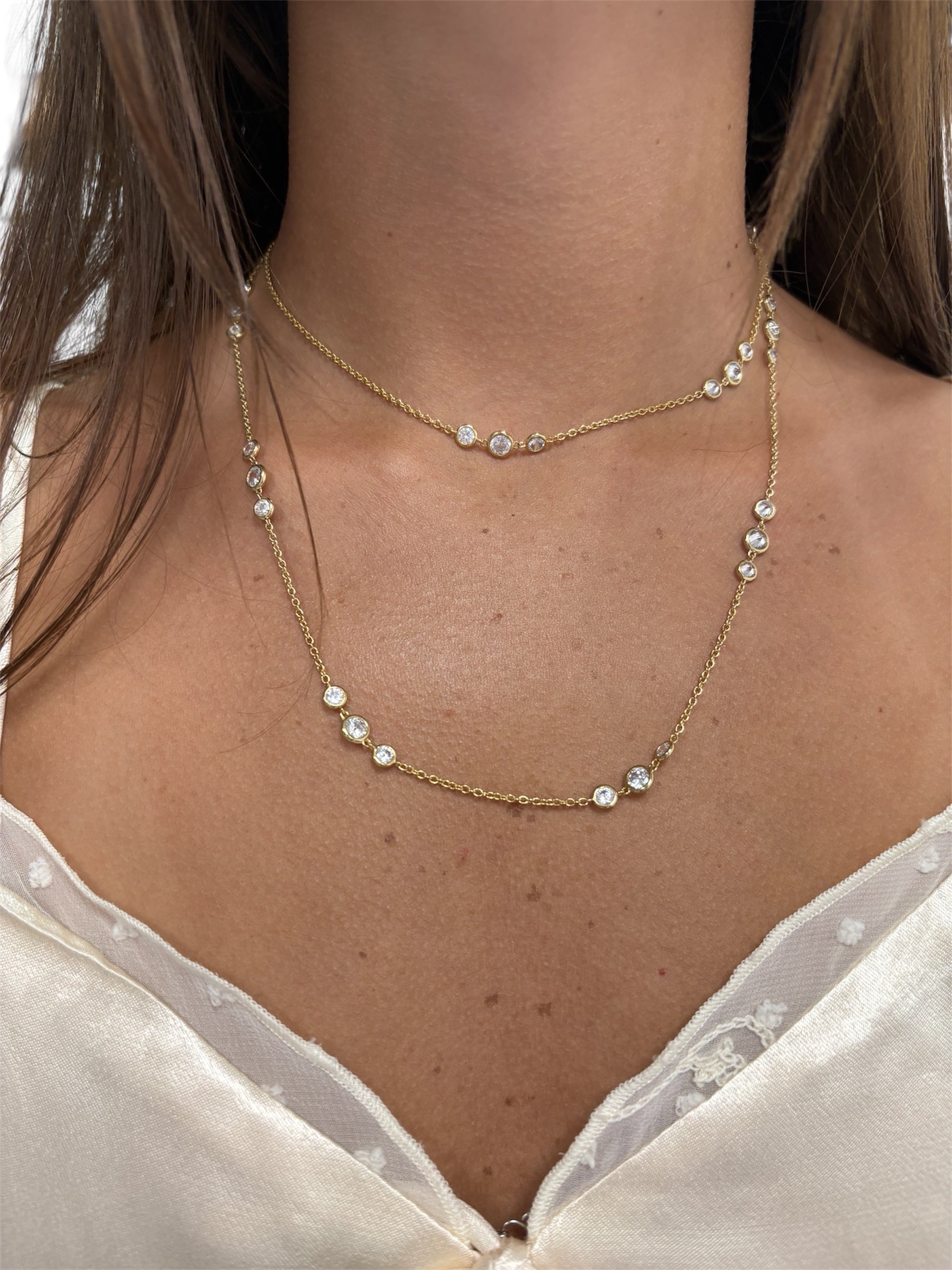 Sterling silver 925 long CZ wrap around necklace from Private Label Jewelry displayed elegantly against a soft background.