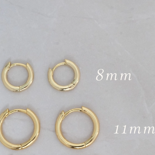 Pink and white minimalist huggie hoop earrings by Private Label featuring a simple, stylish design for modern fashion.