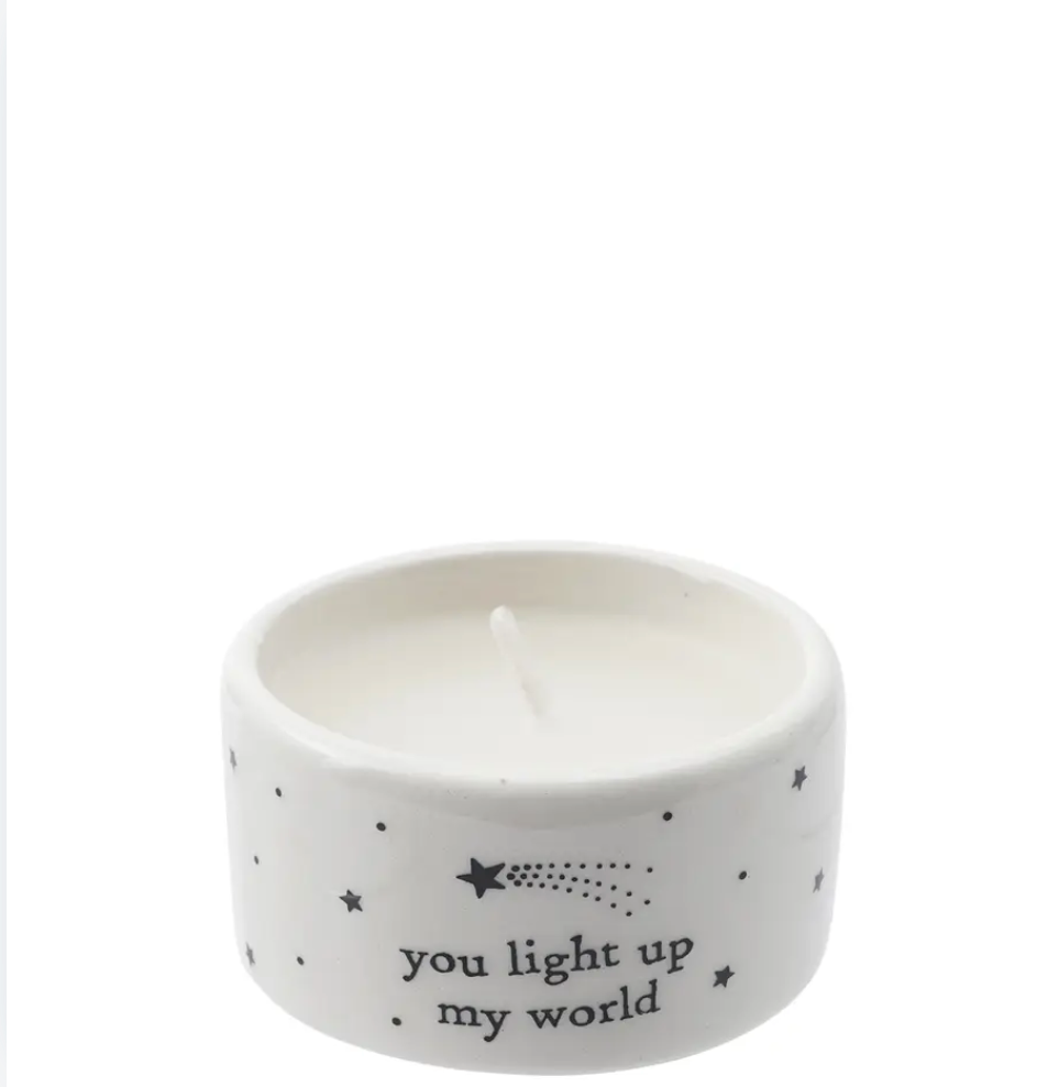 Ceramic tealight from Send with Love featuring "You Light Up My World" text, perfect for gifting and home decor.