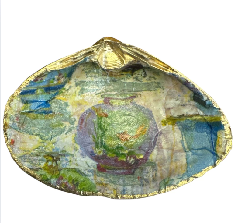 Colorful decoupage shells arranged as a decorative item, showcasing intricate designs and textures.