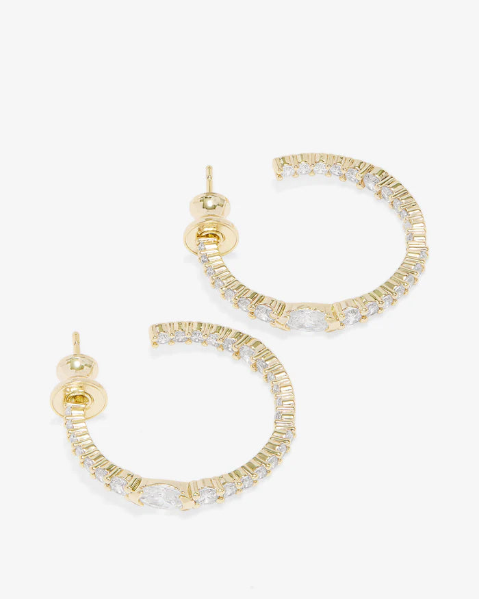 Melinda Maria 1" Maven Hoops earrings featuring a polished gold finish and a classic hoop design.