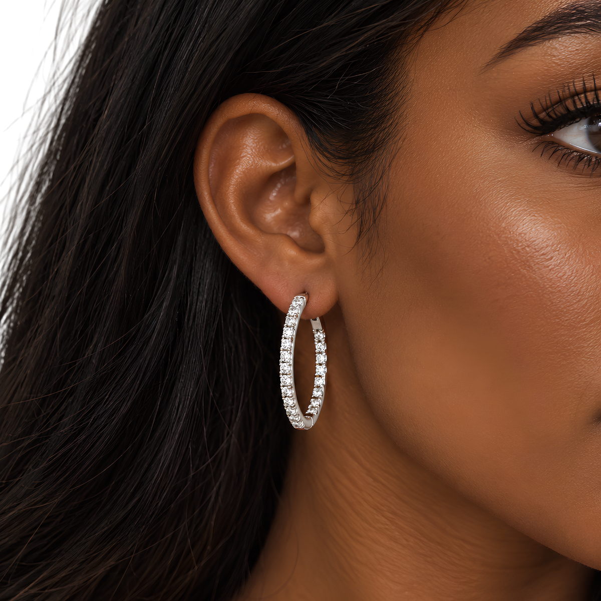 Small CZ sterling silver wrap around hoops earrings by Private Label Jewelry, featuring sparkling cubic zirconia stones and a sleek hoop design.