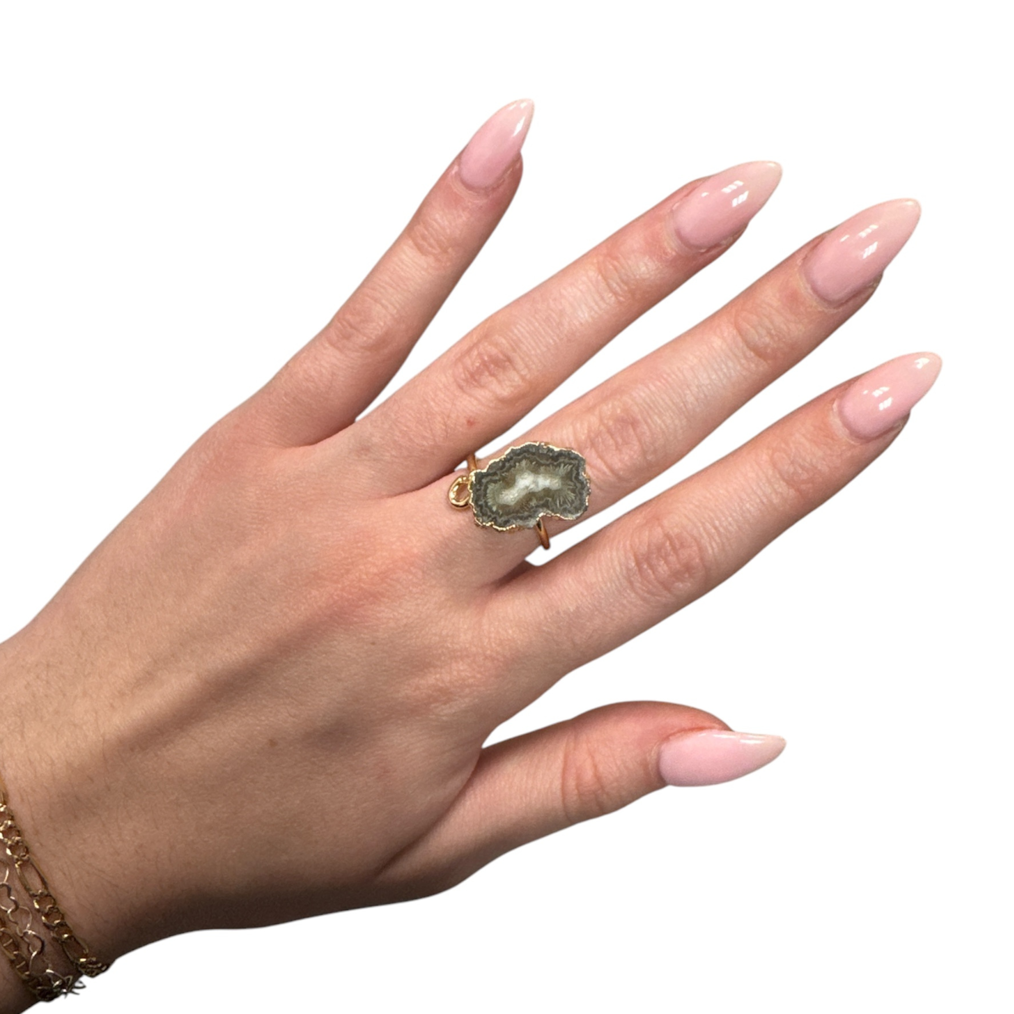 Geo baby ring featuring a colorful geometric design, crafted by Private Label, shown against a neutral background.