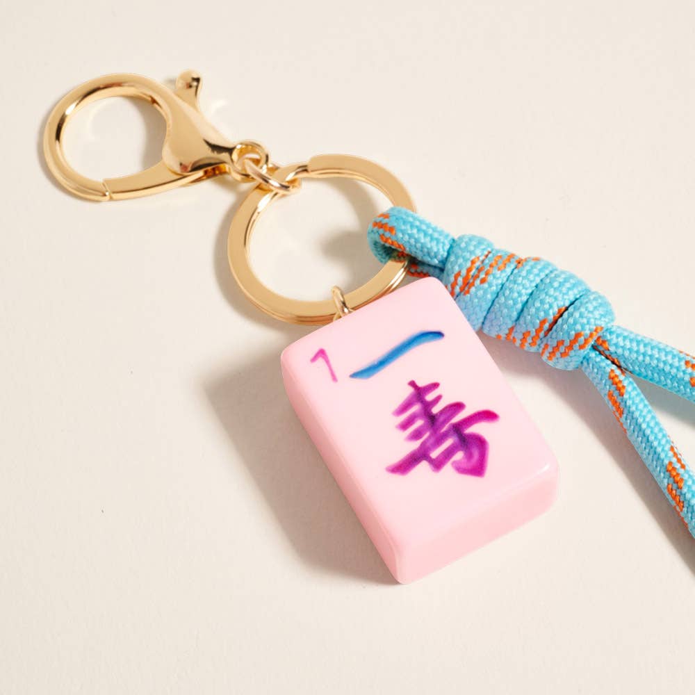 Private label Mahjong Tile Knot Strap Drop Keychain bag charm with decorative tile and knotted design for accessories.