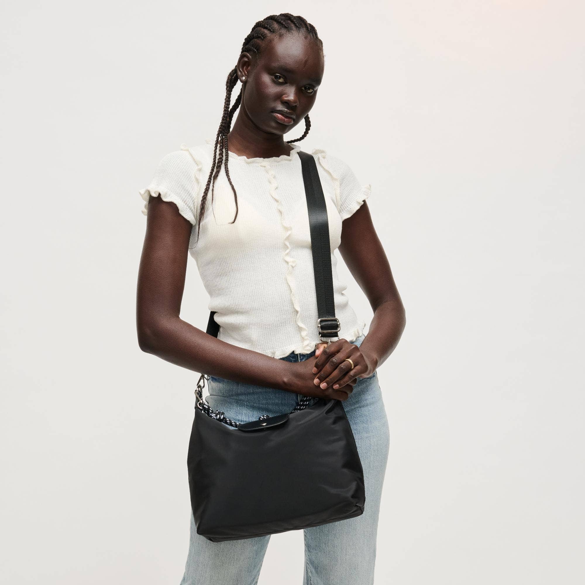 Urban Expressions Nova Hobo bag with soft leather and adjustable strap, featuring a spacious main compartment and stylish design.