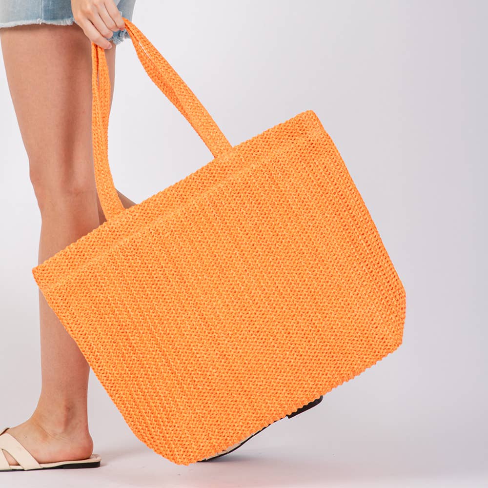 Solid crochet straw tote bag from Private label, stylish beach handbag with woven design and spacious interior.