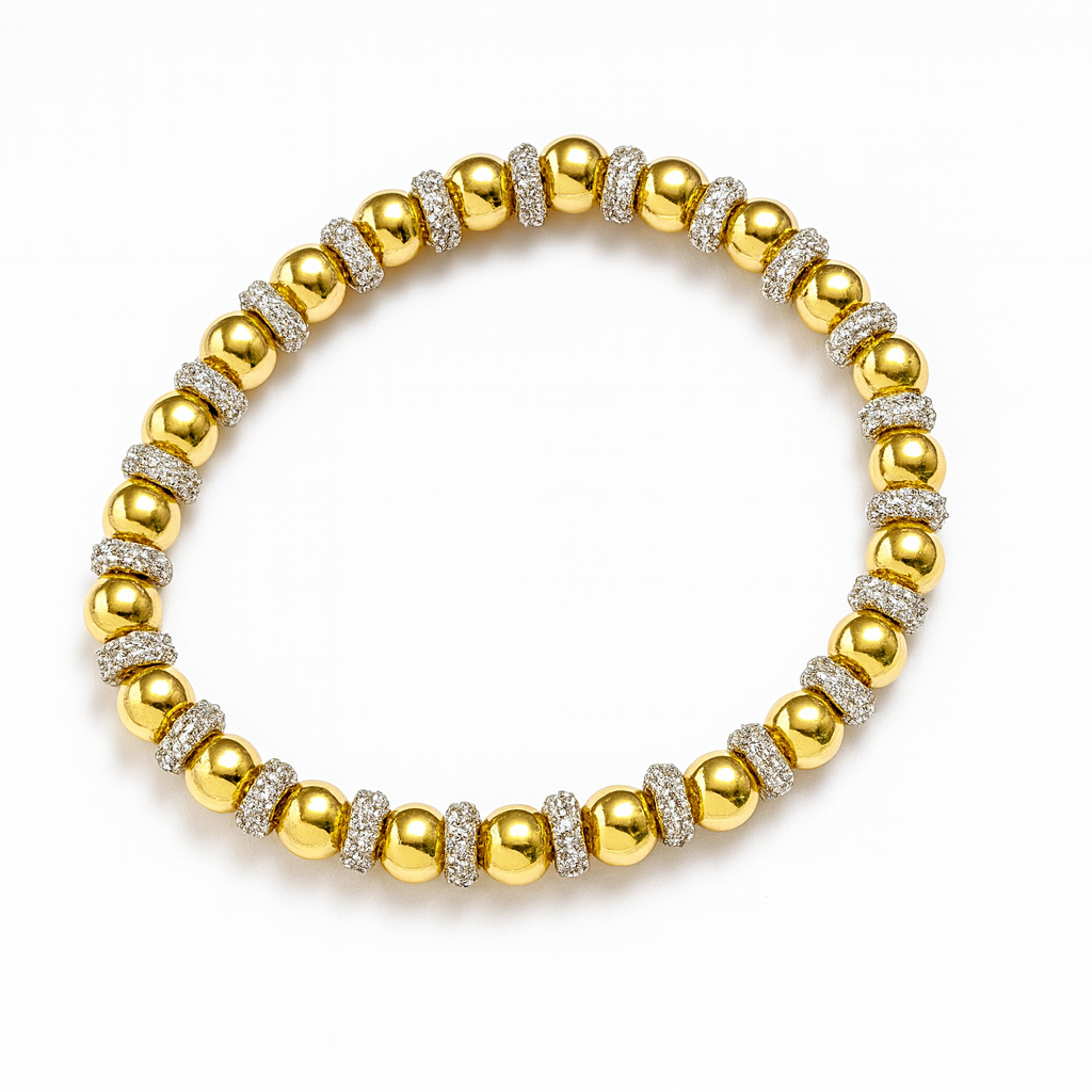 6 mm gold bracelet with silver baller spacers from The Skylar Project, elegantly displayed on a neutral background.