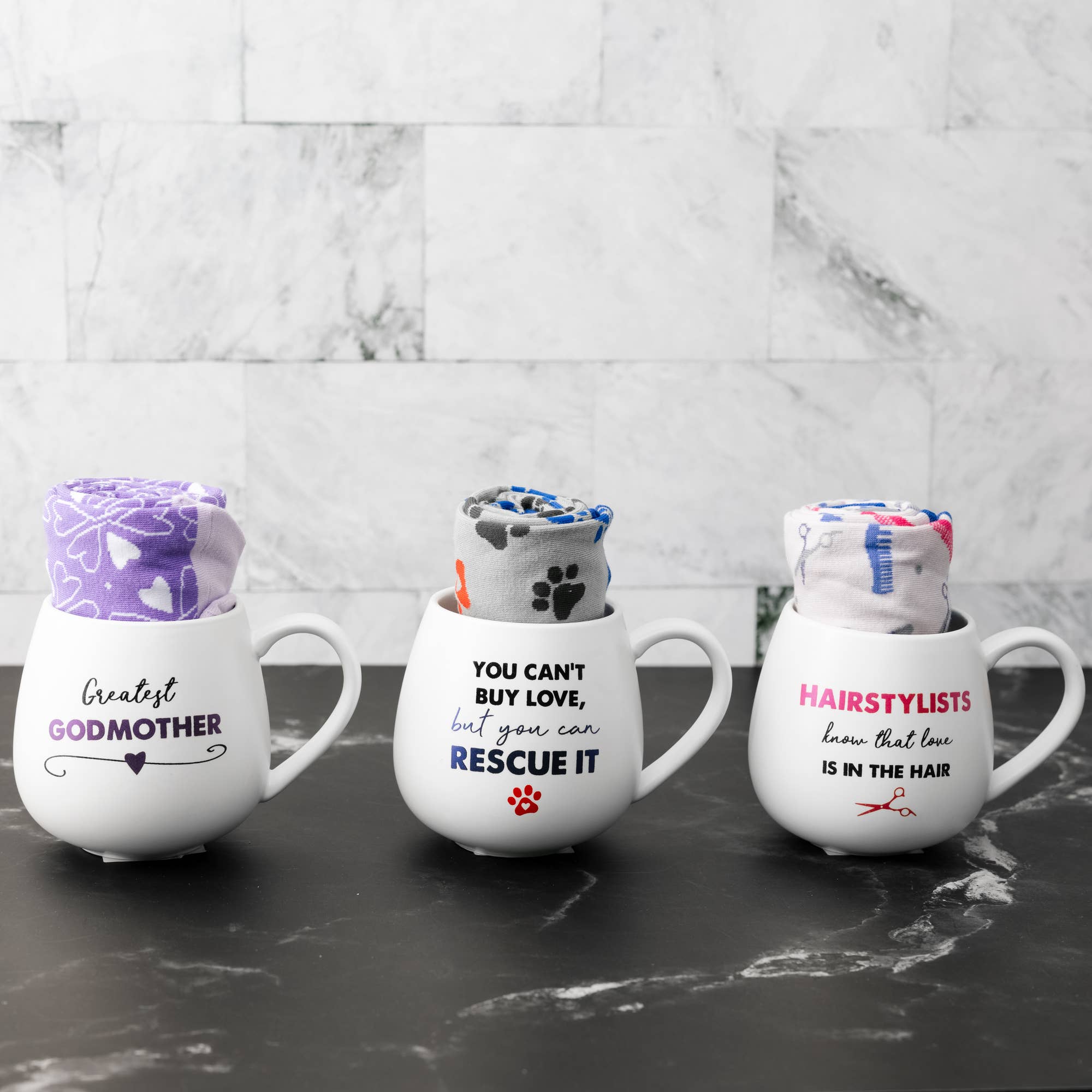 Pavilion Rescue mug and sock set featuring a colorful design and cozy socks displayed together on a wooden surface.