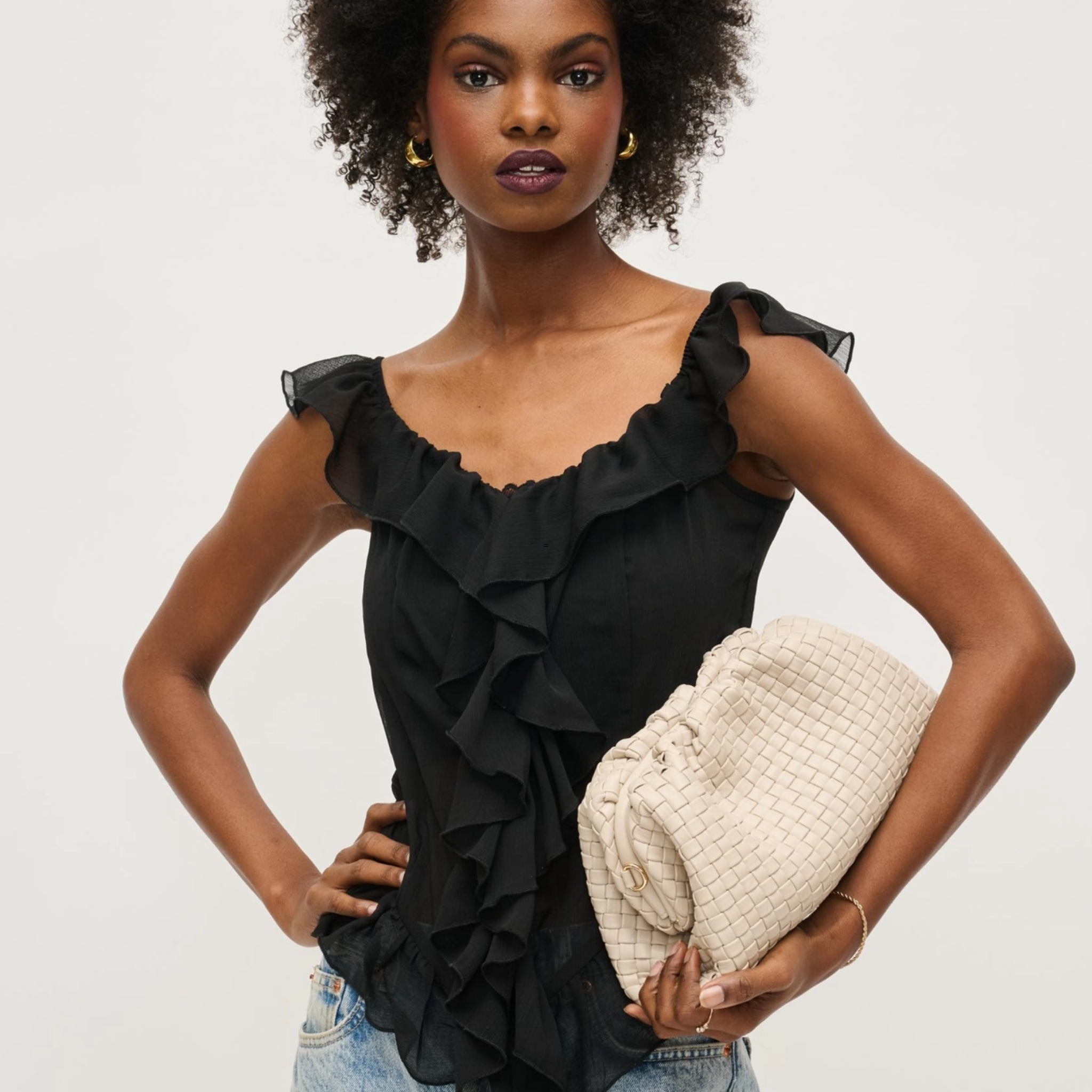 Black woven frame clutch by Urban Expressions with rhinestone embellishments, stylish evening bag for formal occasions.