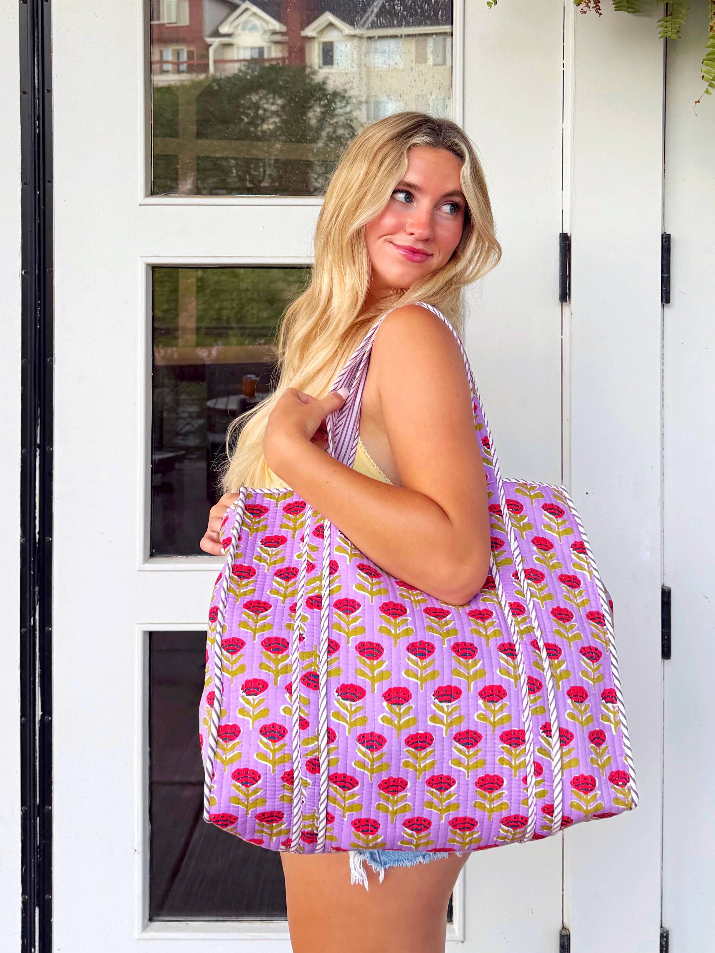 Large purple floral quilted tote bag by Folklore Couture, featuring sturdy handles and a spacious interior for shopping.