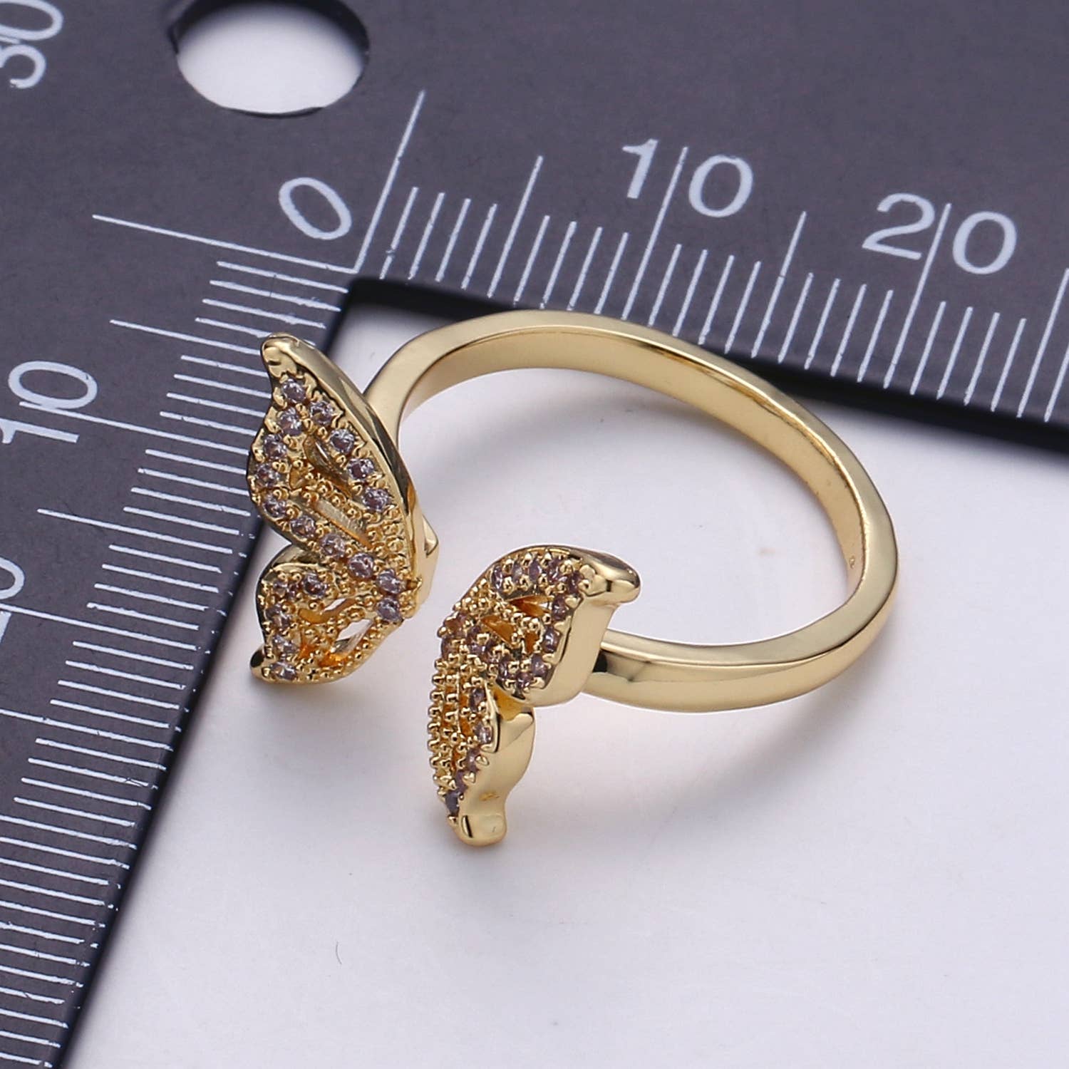 Private label CZ open butterfly ring with intricate silver band and detailed butterfly design on the top.