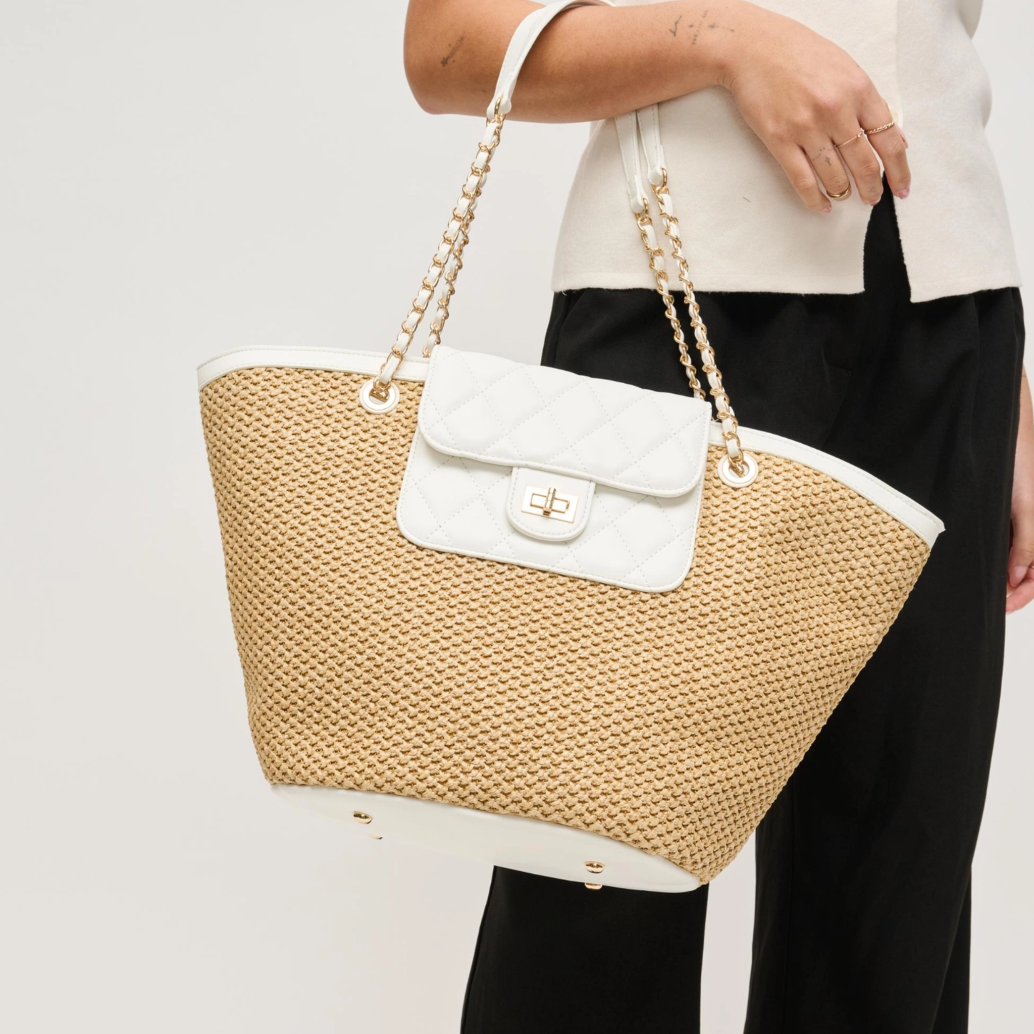 Urban Expressions Landon Tote shoulder bag with a coquette heart and bow bag charm, stylish and spacious accessory.